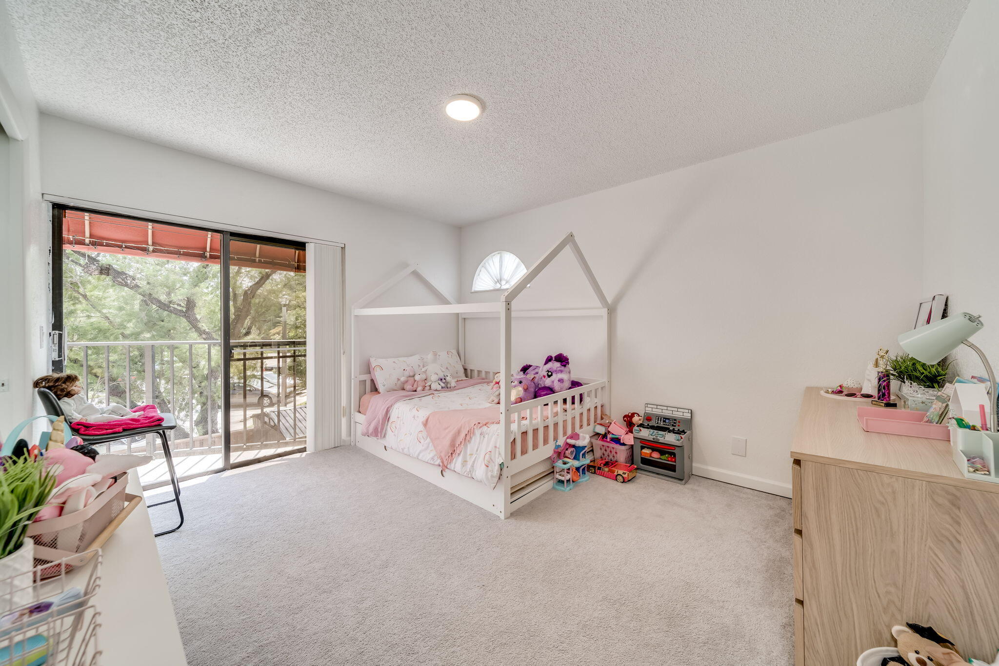8116 Severn Drive, Unit C Boca Raton, FL 33433 - Photo 26 of 52 a bed room with a bed and a chair