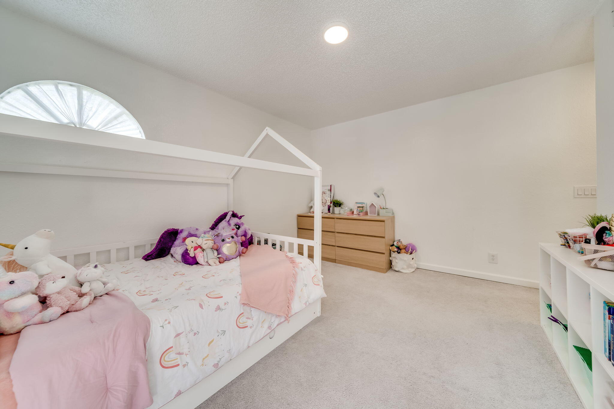8116 Severn Drive, Unit C Boca Raton, FL 33433 - Photo 27 of 52 a bedroom with a bed and cabinets