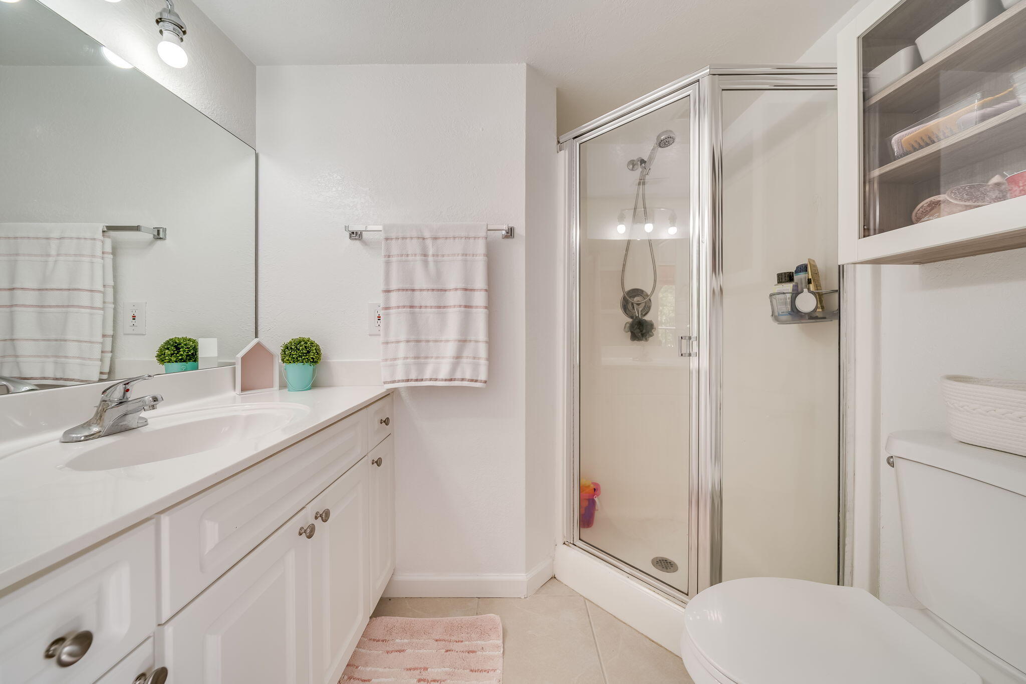 8116 Severn Drive, Unit C Boca Raton, FL 33433 - Photo 28 of 52 a bathroom with a granite countertop shower sink and toilet