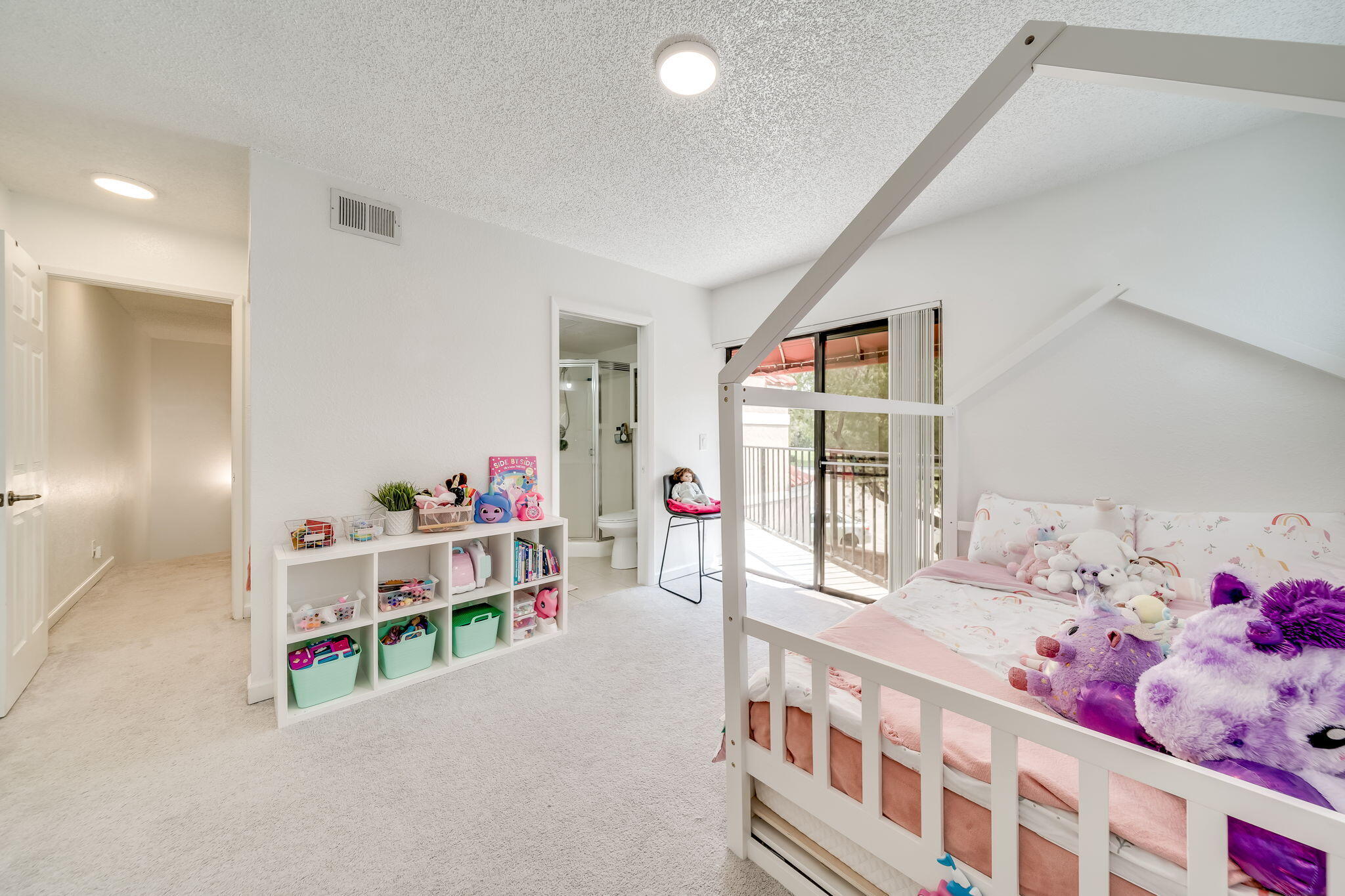 8116 Severn Drive, Unit C Boca Raton, FL 33433 - Photo 29 of 52 a bedroom with furniture a baby crib and a window