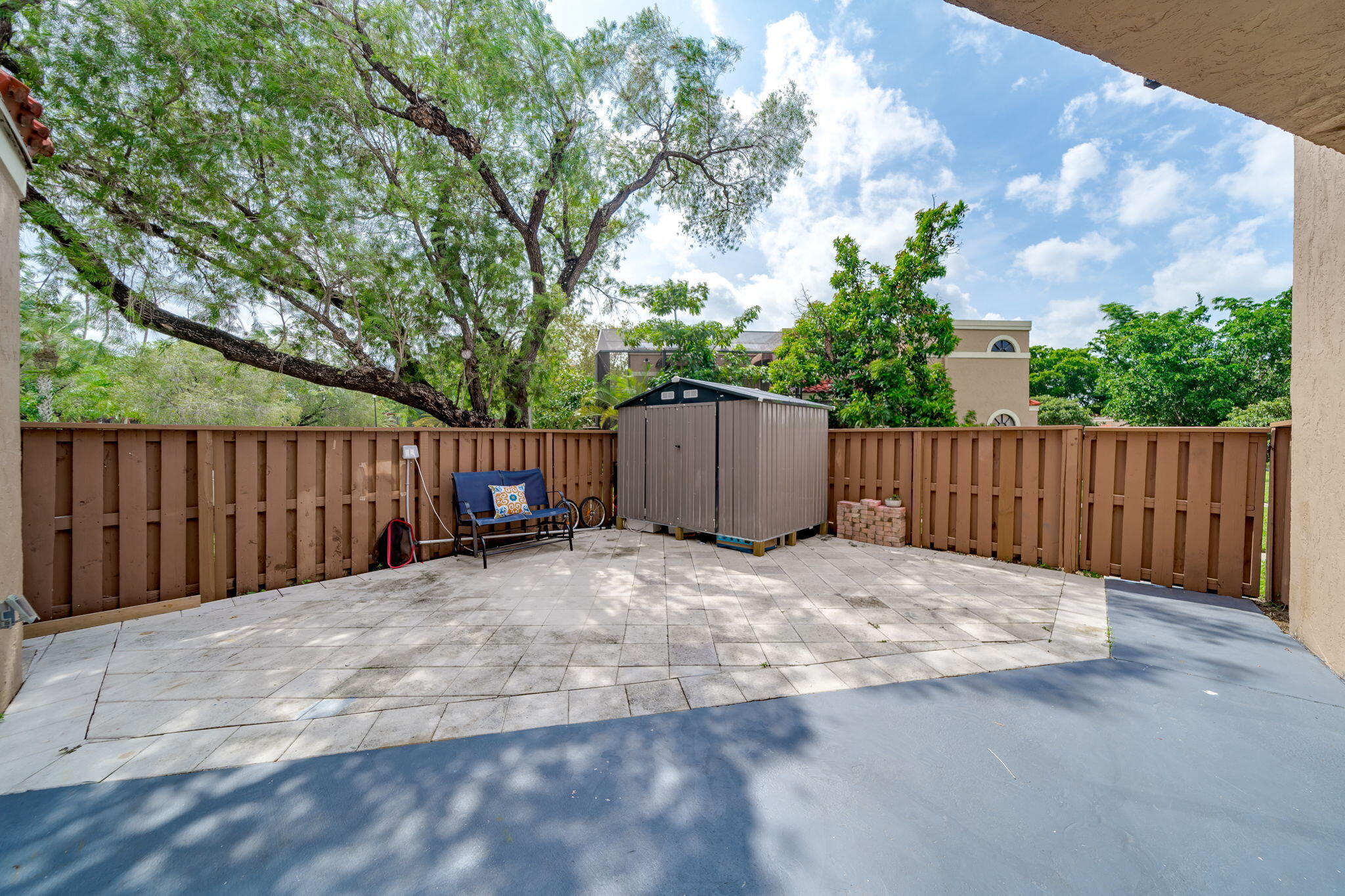 8116 Severn Drive, Unit C Boca Raton, FL 33433 - Photo 33 of 52 a backyard of a house