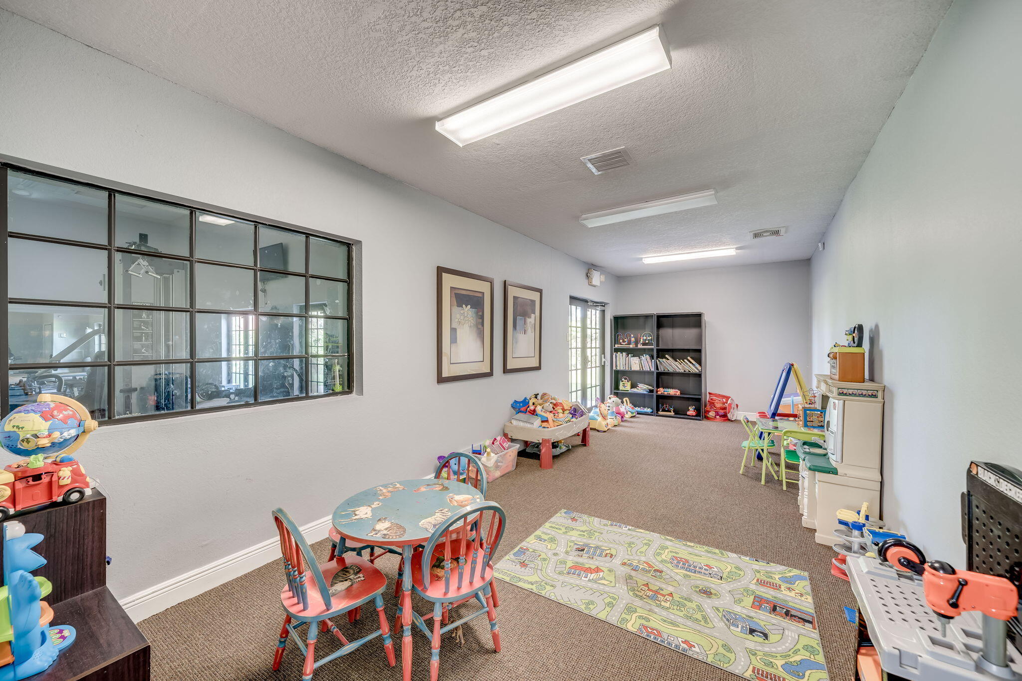 8116 Severn Drive, Unit C Boca Raton, FL 33433 - Photo 42 of 52 a living room with furniture and a window
