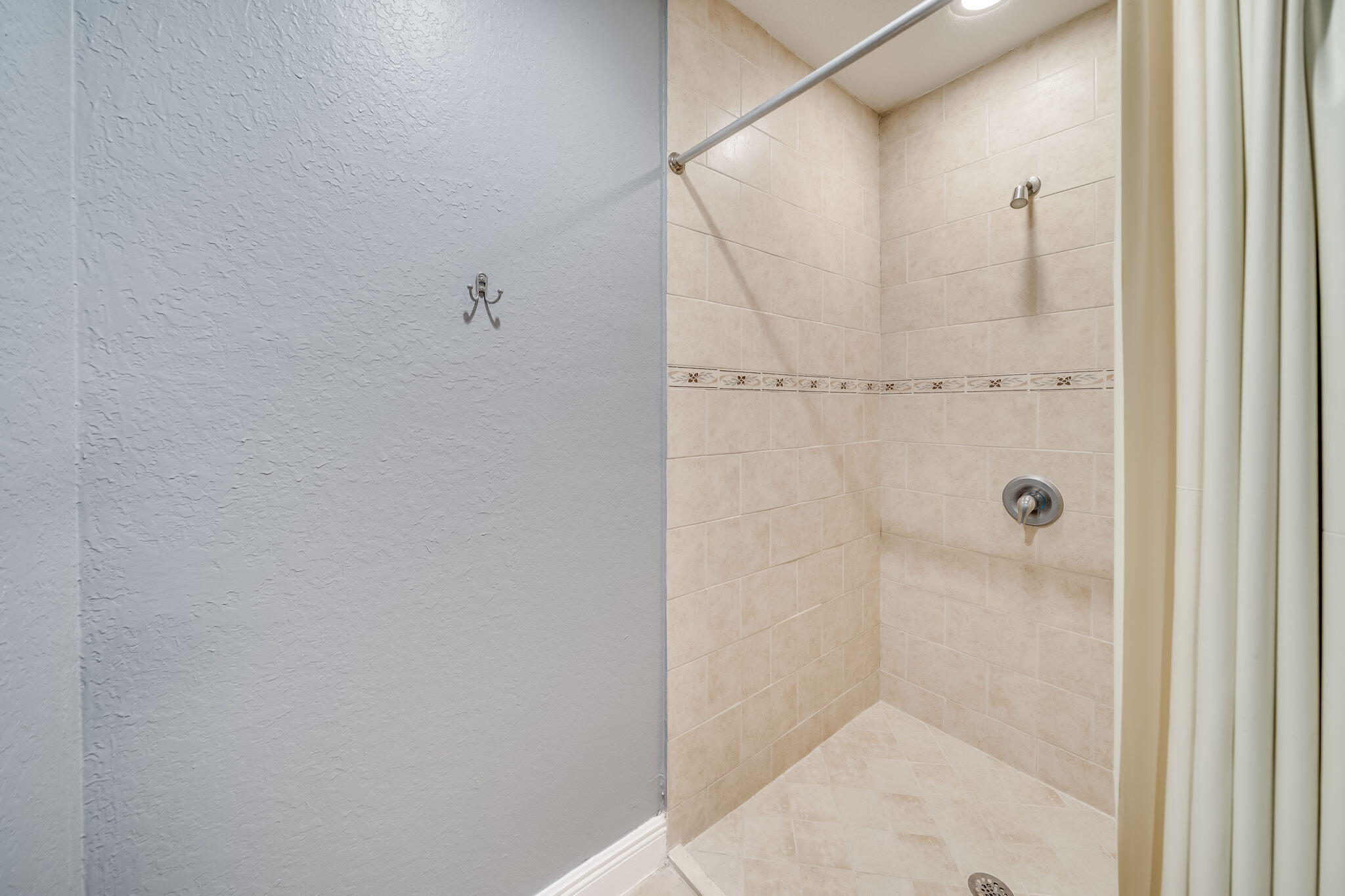 8116 Severn Drive, Unit C Boca Raton, FL 33433 - Photo 45 of 52 a bathroom with a shower