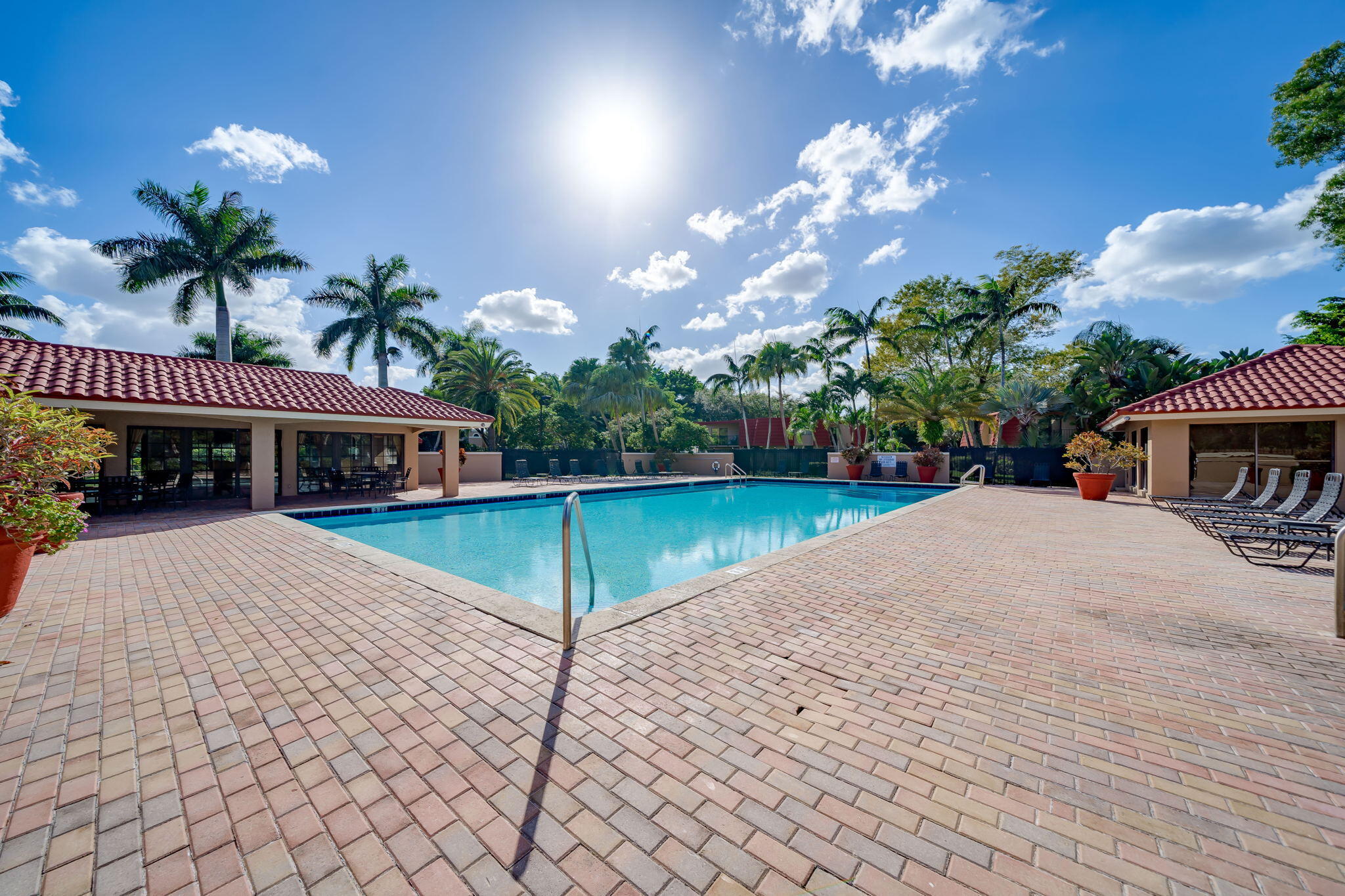 8116 Severn Drive, Unit C Boca Raton, FL 33433 - Photo 46 of 52 a view of a house with a yard and a patio