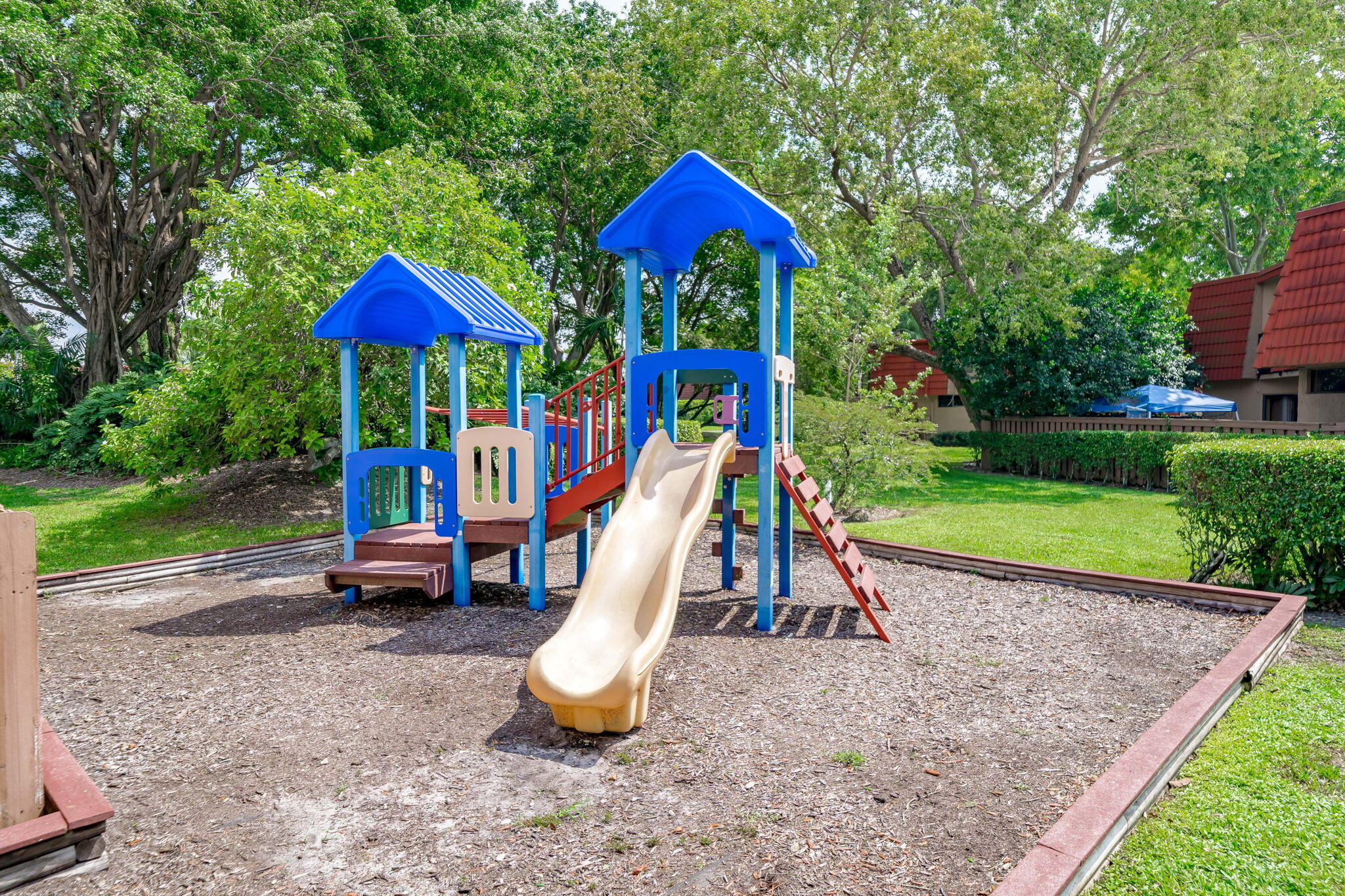 8116 Severn Drive, Unit C Boca Raton, FL 33433 - Photo 50 of 52 a view of outdoor space with playground and green space