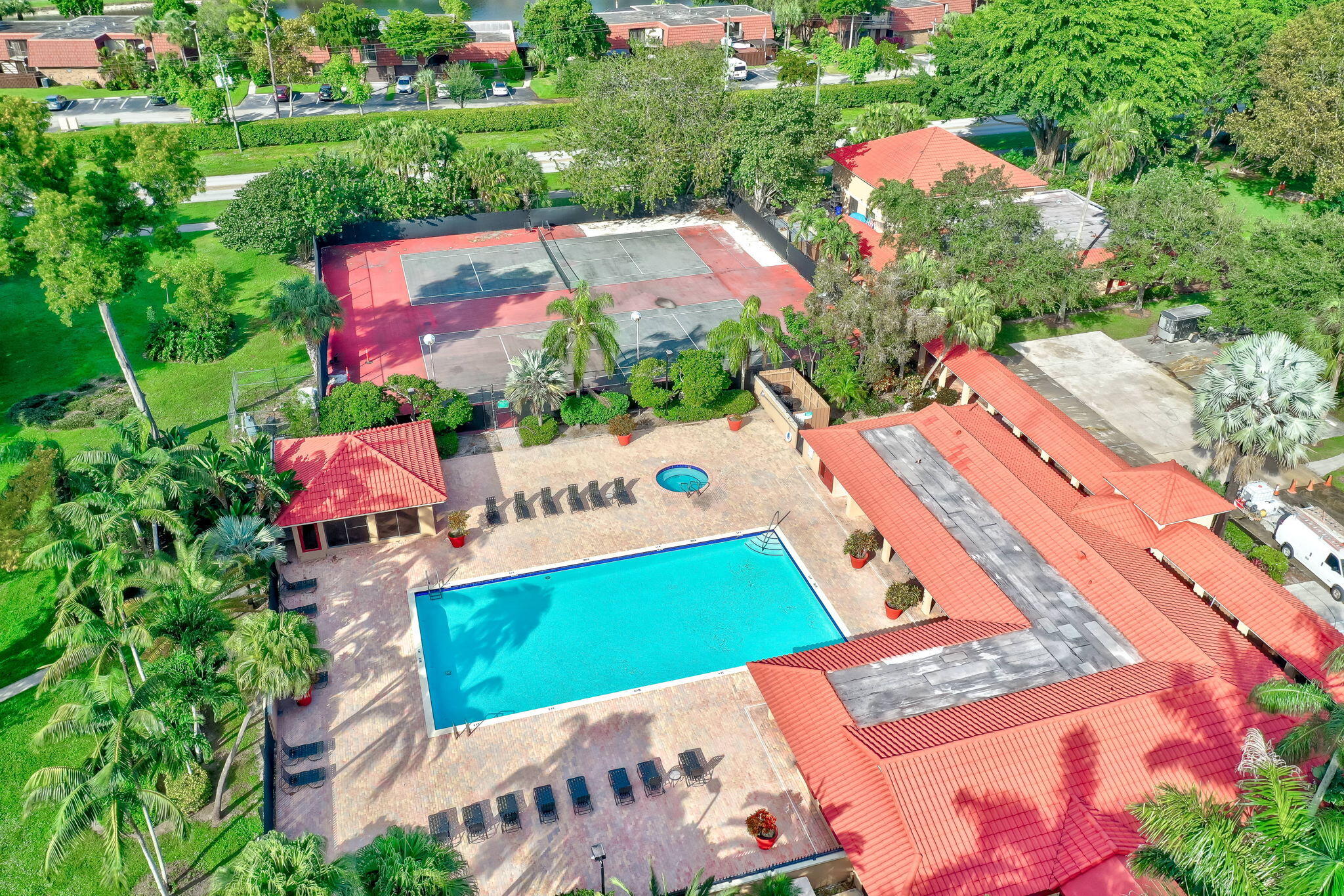8116 Severn Drive, Unit C Boca Raton, FL 33433 - Photo 51 of 52 an aerial view of a tennis ground and a yard