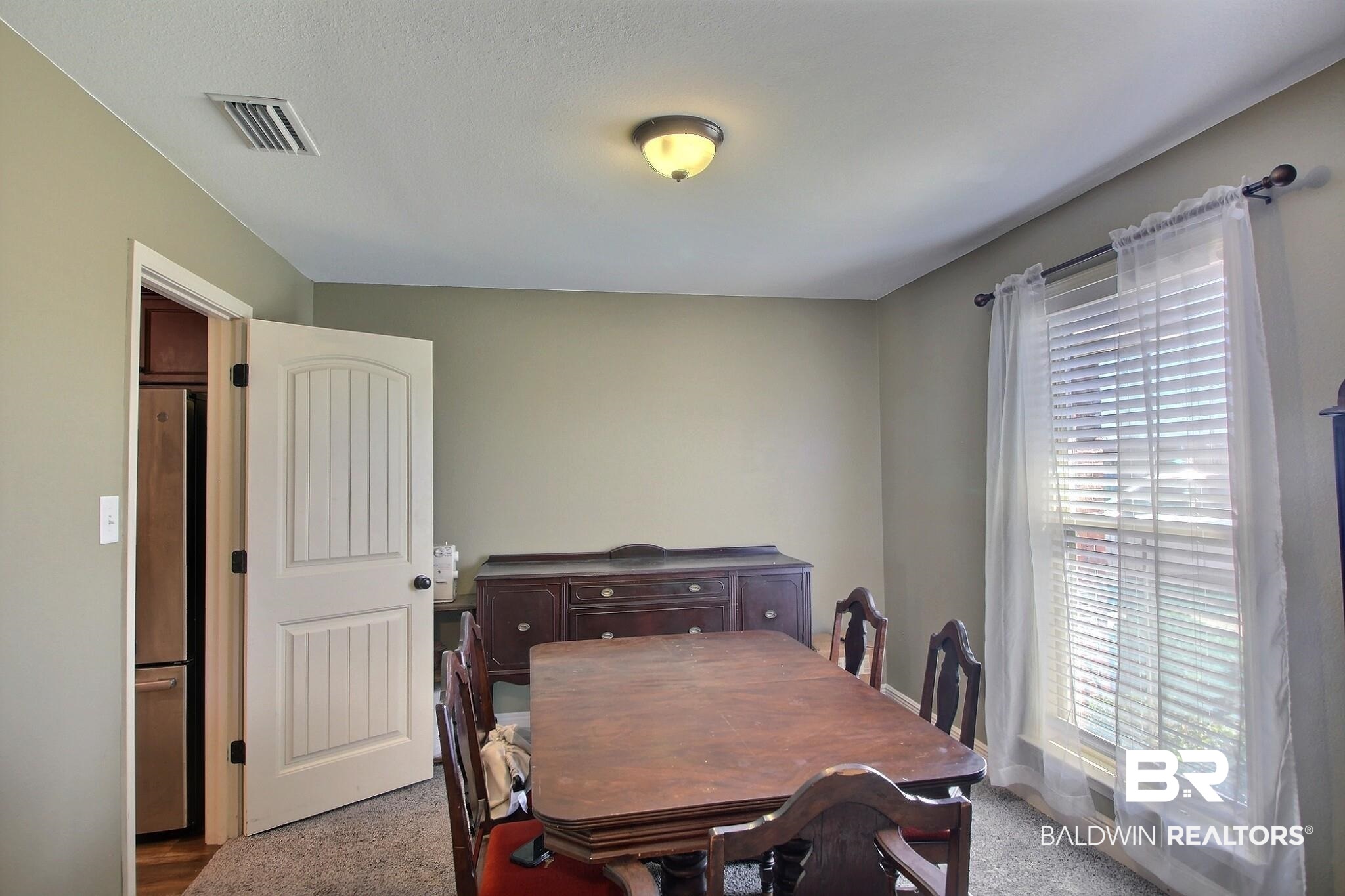 15577 Talus Court Foley, AL 36535 - Photo 5 of 28 View of carpeted dining area