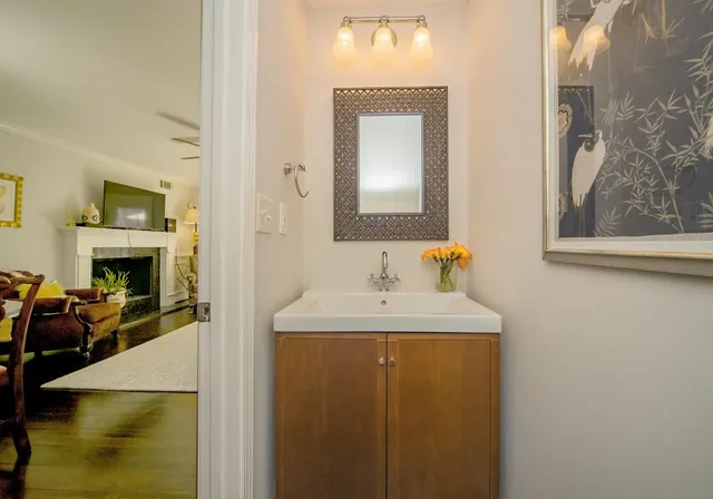 a bathroom with a sink and a mirror
