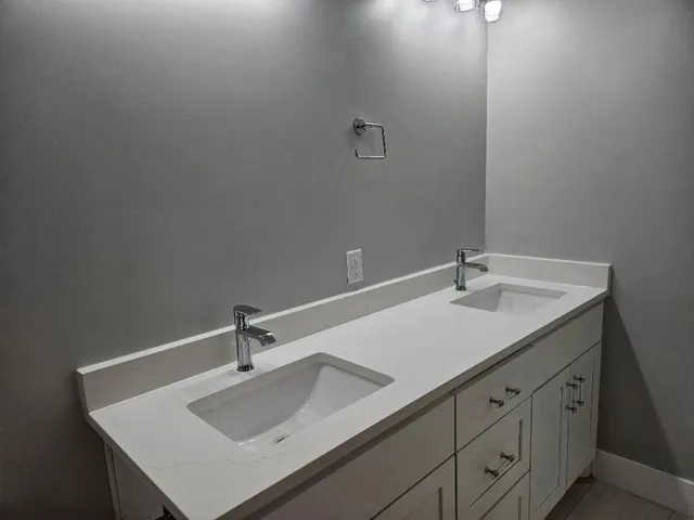 a bathroom with a sink and a vanity