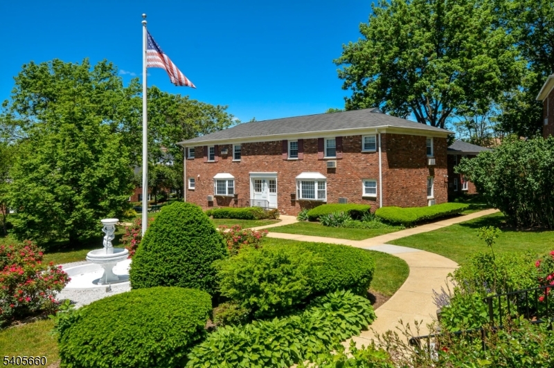 26 Locust Drive, Unit 47 Summit, NJ 07901 - Photo 1 of 12 a front view of a house with a yard