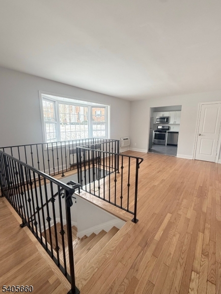 26 Locust Drive, Unit 47 Summit, NJ 07901 - Photo 4 of 12 a view of a livingroom with wooden floor and furniture