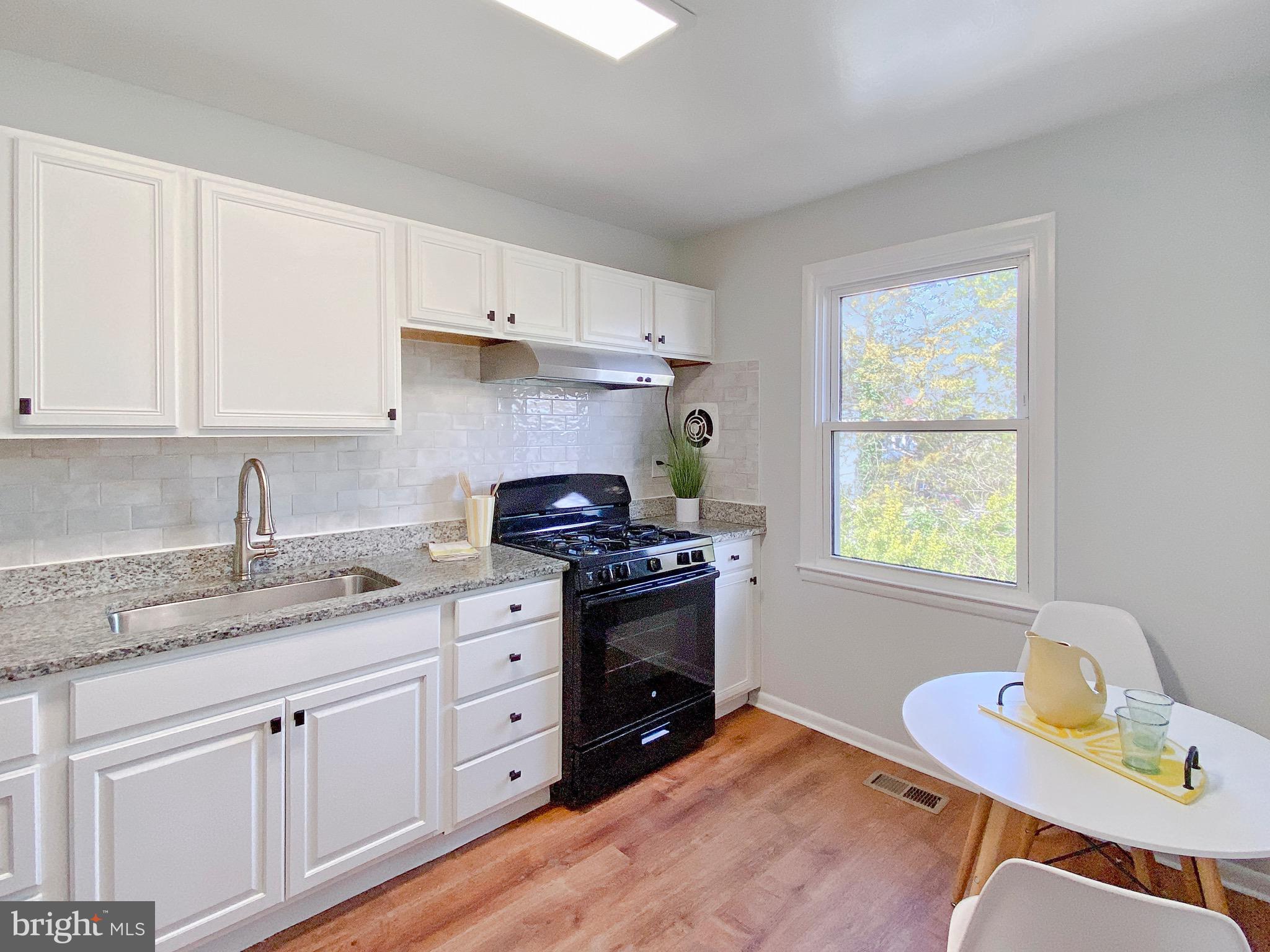 8368 Imperial Drive, Unit 2B Laurel, MD 20708 - Photo 12 of 25 Fully renovated Kitchen w/new granite countertop