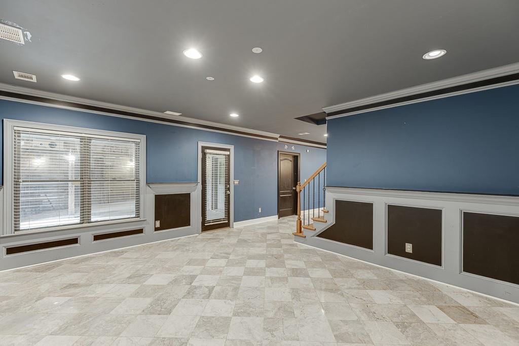940 Chateau Forest Road Hoschton, GA 30548 - Photo 63 of 87 a view of an empty room with a fireplace and a large window