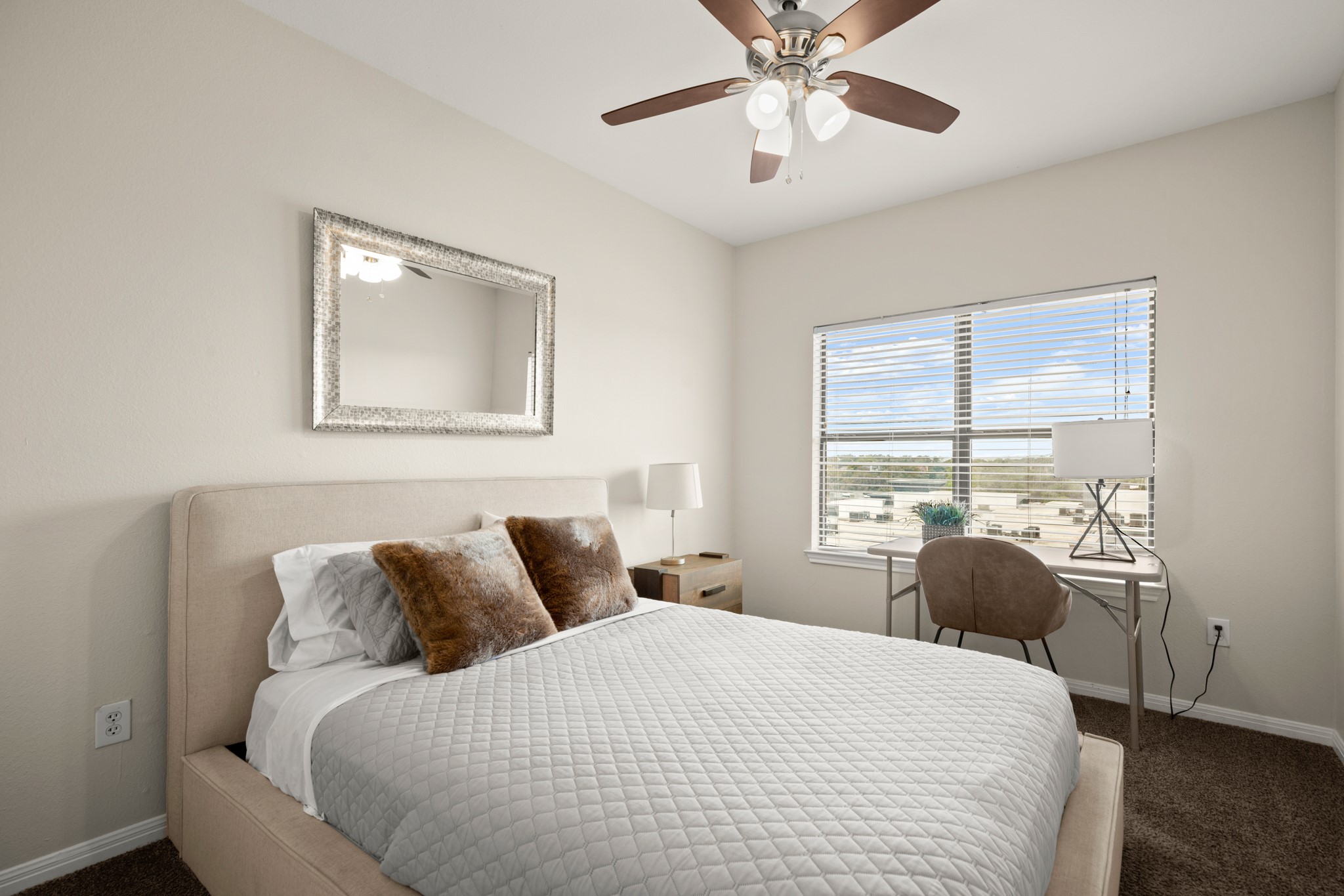 2502 Leon Street, Unit 512 Austin, TX 78705 - Photo 11 of 27 The primary bedroom offers a comfortable retreat with a large window that brings in natural light.
