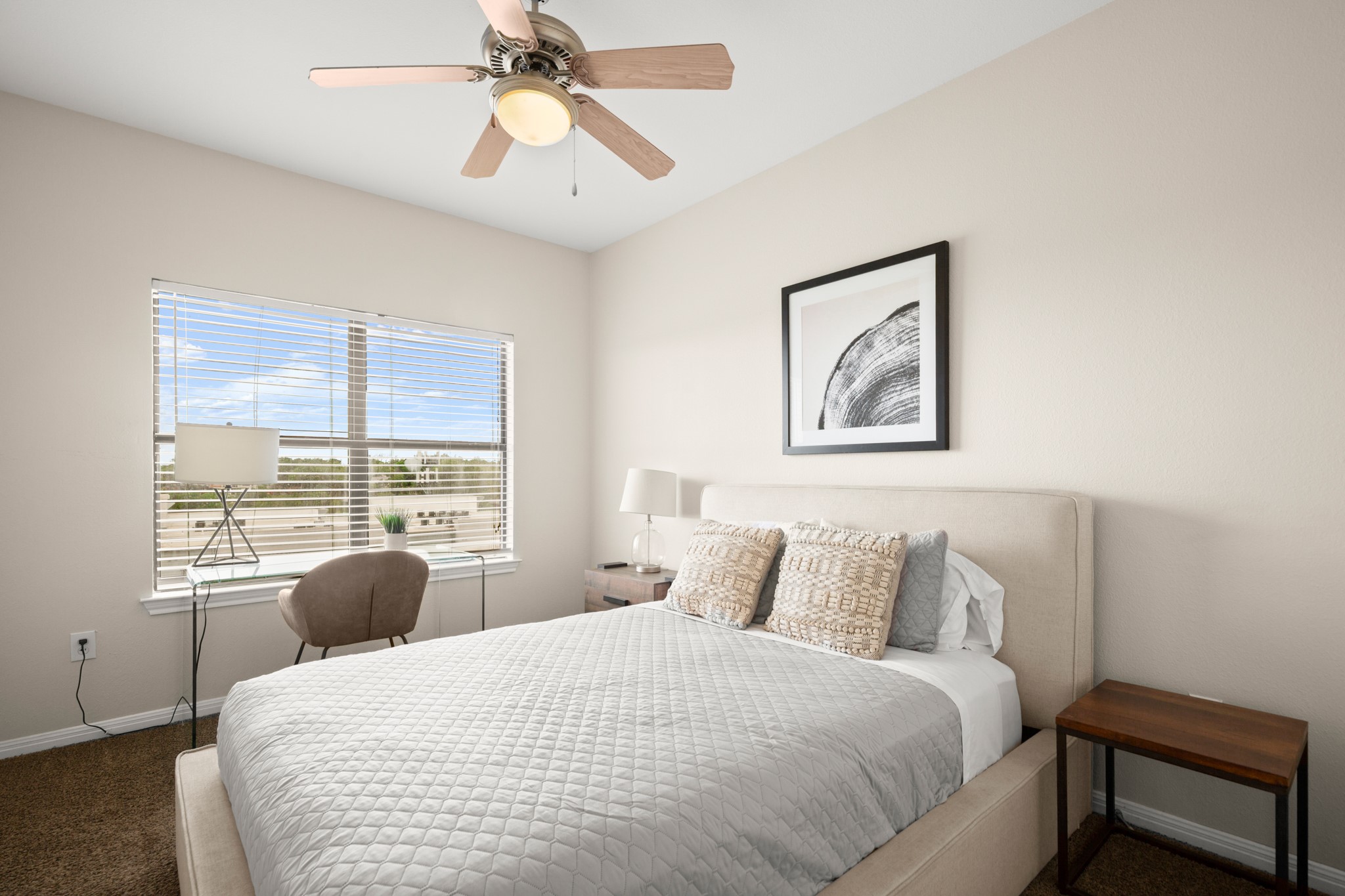 2502 Leon Street, Unit 512 Austin, TX 78705 - Photo 12 of 27 Neutral tones and soft carpeting create a relaxed and inviting atmosphere.