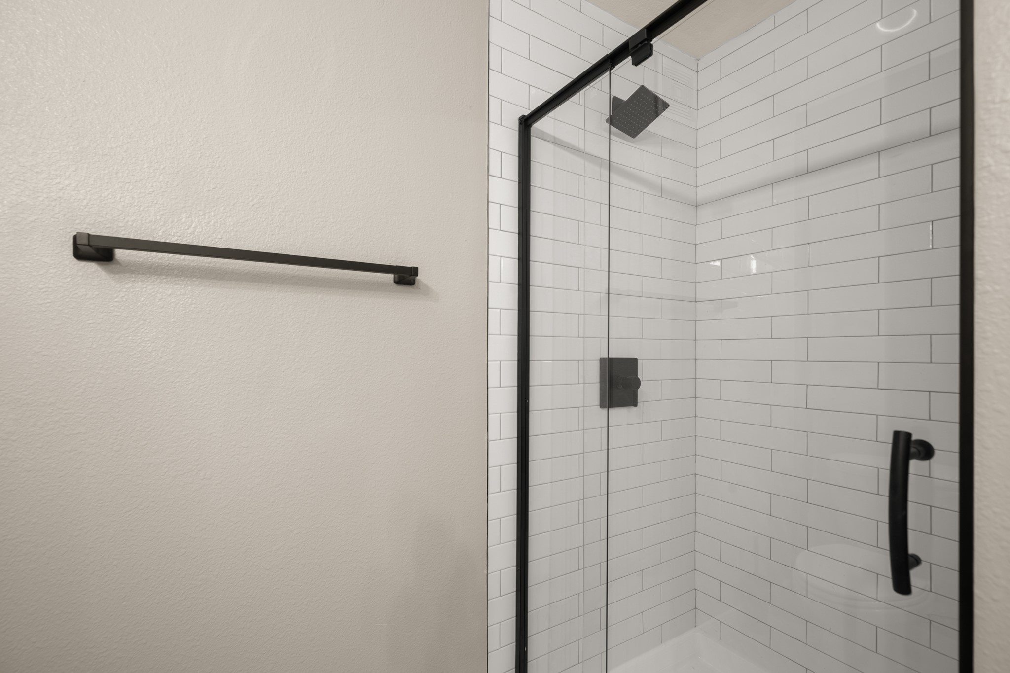 2502 Leon Street, Unit 512 Austin, TX 78705 - Photo 14 of 27 The bathroom features a spacious walk-in shower designed for everyday comfort and convenience.