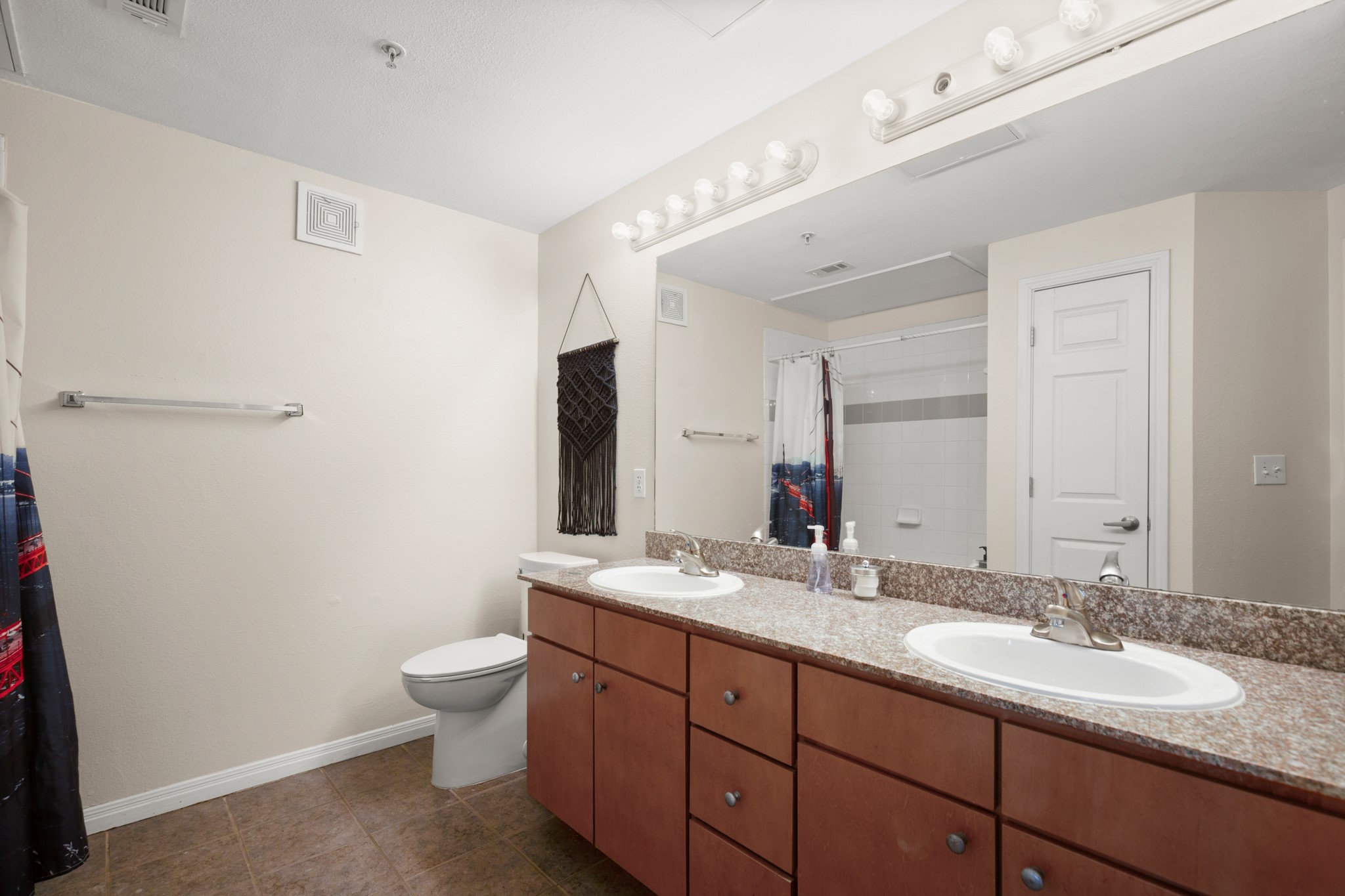2502 Leon Street, Unit 512 Austin, TX 78705 - Photo 16 of 27 The guest bathroom features a spacious vanity with ample counter space for everyday use.