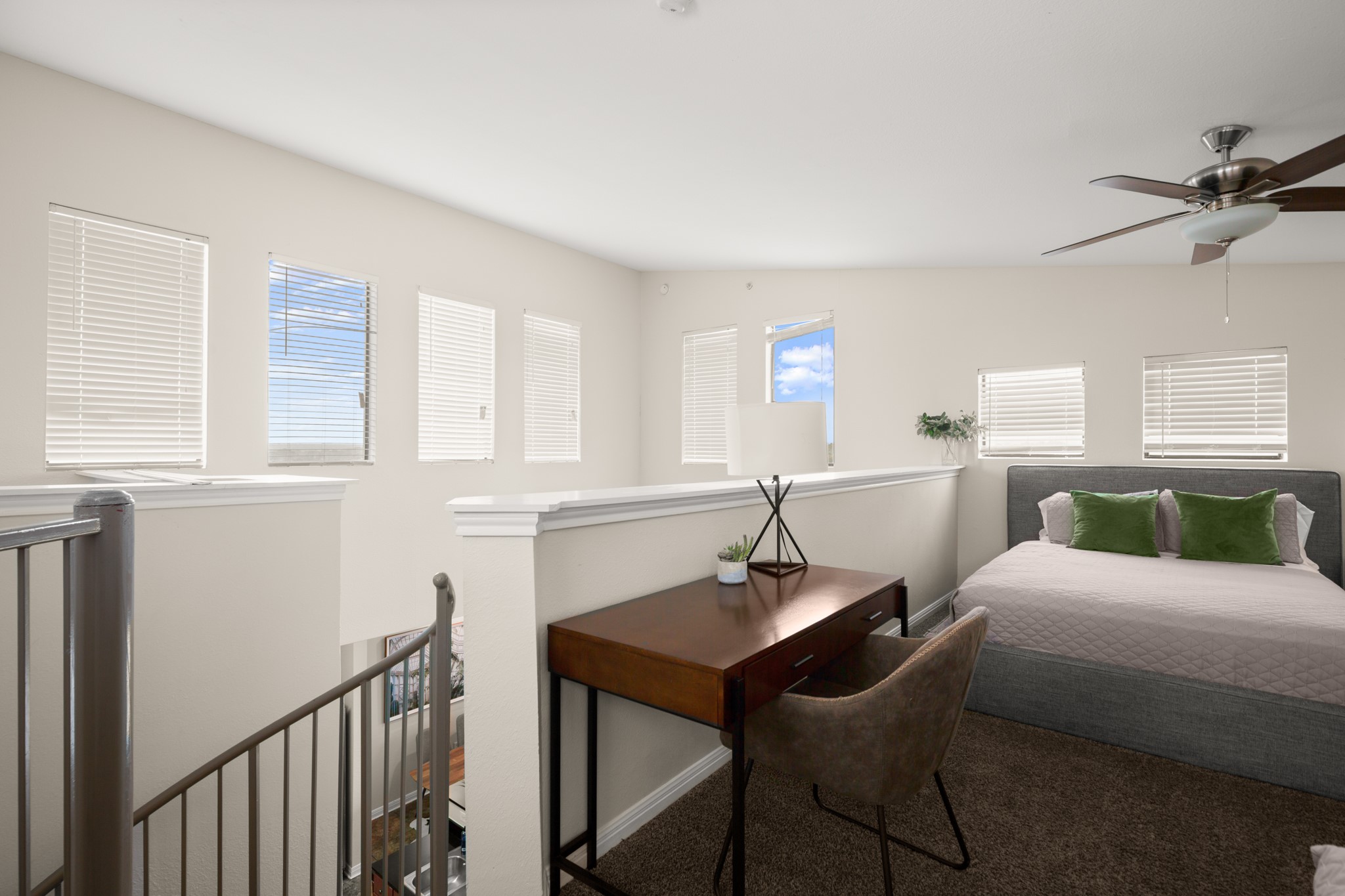 2502 Leon Street, Unit 512 Austin, TX 78705 - Photo 20 of 27 The open loft design overlooks the lower level and enhances the home's spacious feel.