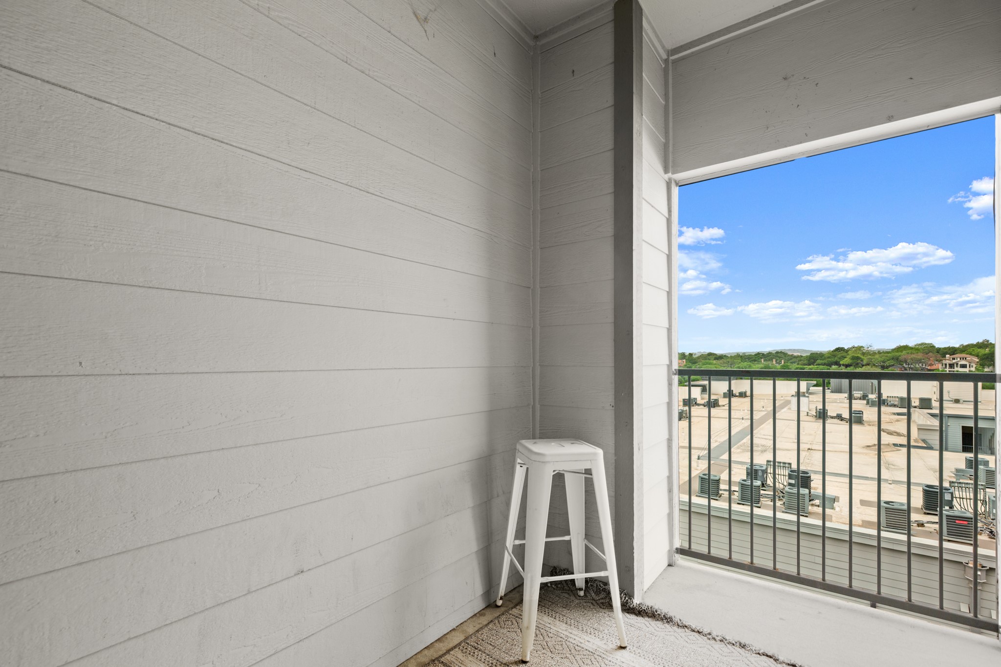 2502 Leon Street, Unit 512 Austin, TX 78705 - Photo 23 of 27 The private balcony offers a comfortable outdoor space to relax and enjoy fresh air.