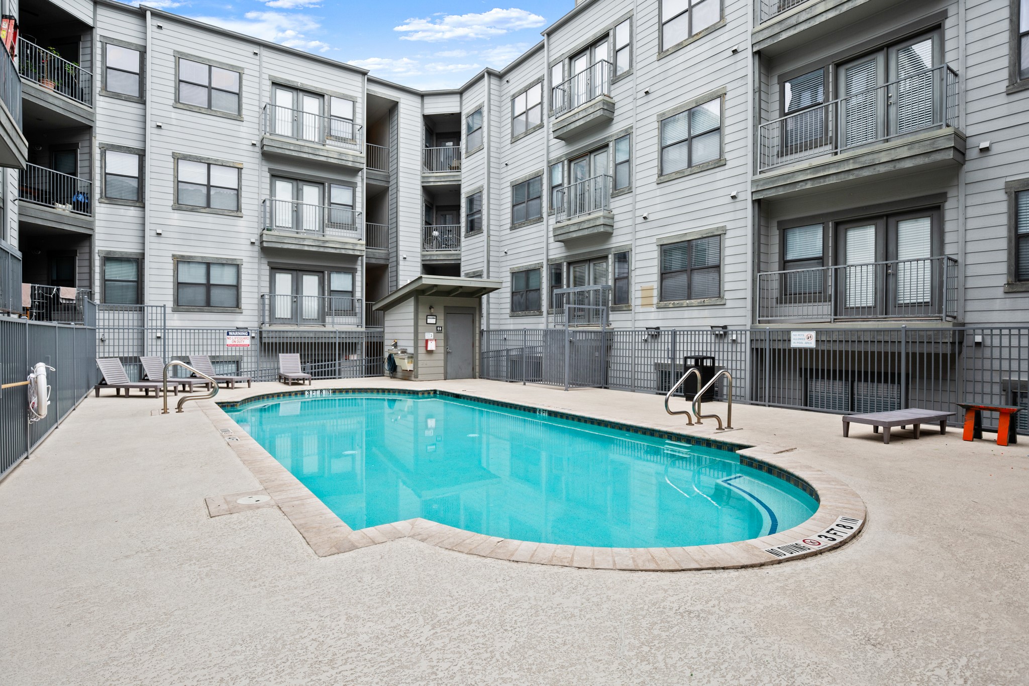 2502 Leon Street, Unit 512 Austin, TX 78705 - Photo 25 of 27 Residents enjoy access to a refreshing community pool within the Texan Shoal Creek community.