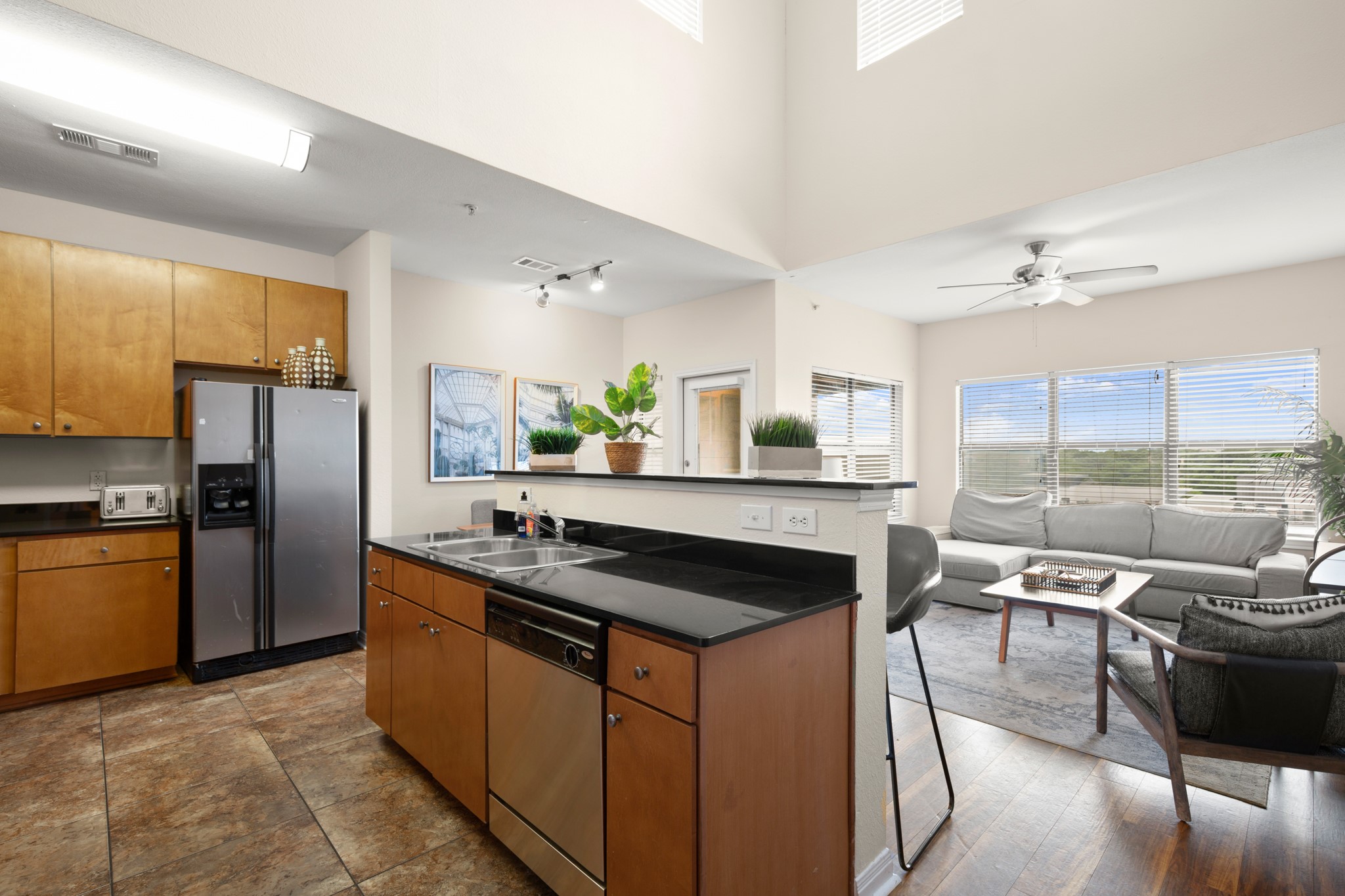 2502 Leon Street, Unit 512 Austin, TX 78705 - Photo 8 of 27 A breakfast bar provides additional seating and a functional workspace for meal preparation.