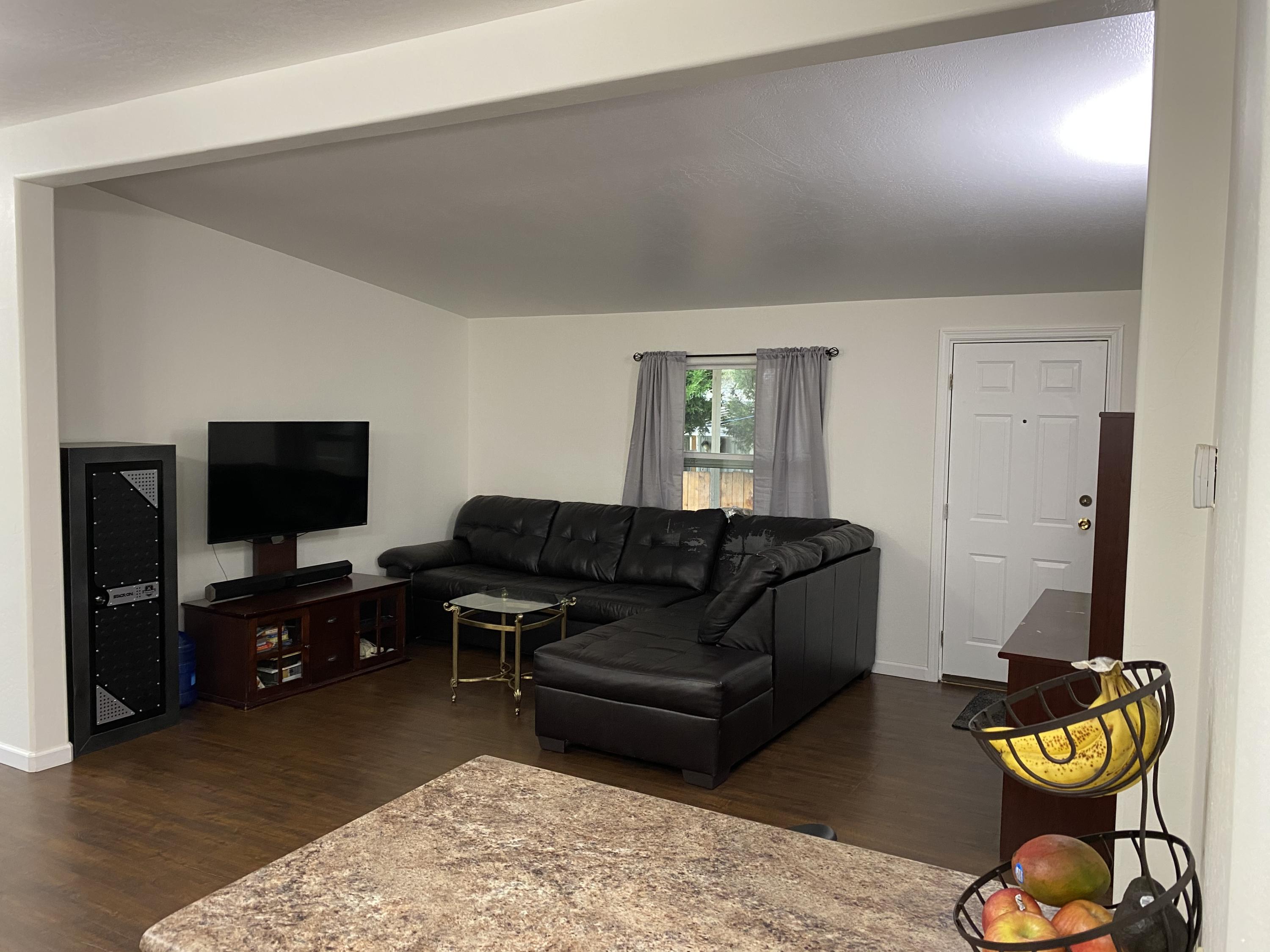 939 South Valley Road, Unit 10 Ashland, OR 97520 - Photo 2 of 23 Vaulted living room ceilings with new laminated flooring throughout.