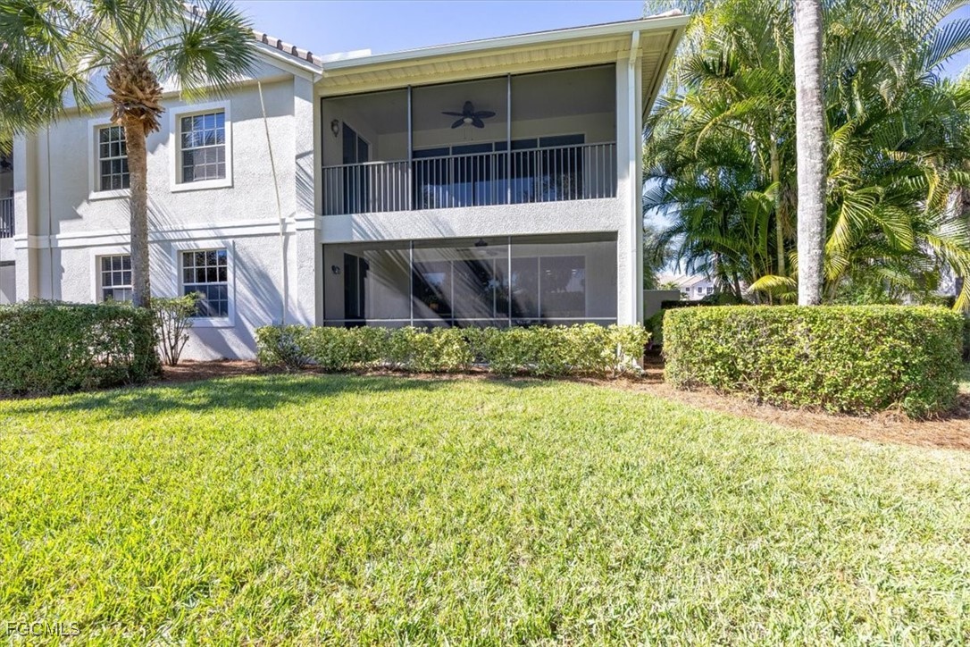 13091 Pebblebrook Ridge Court, Unit 101 Fort Myers, FL 33905 - Photo 16 of 39 a front view of a house with a yard