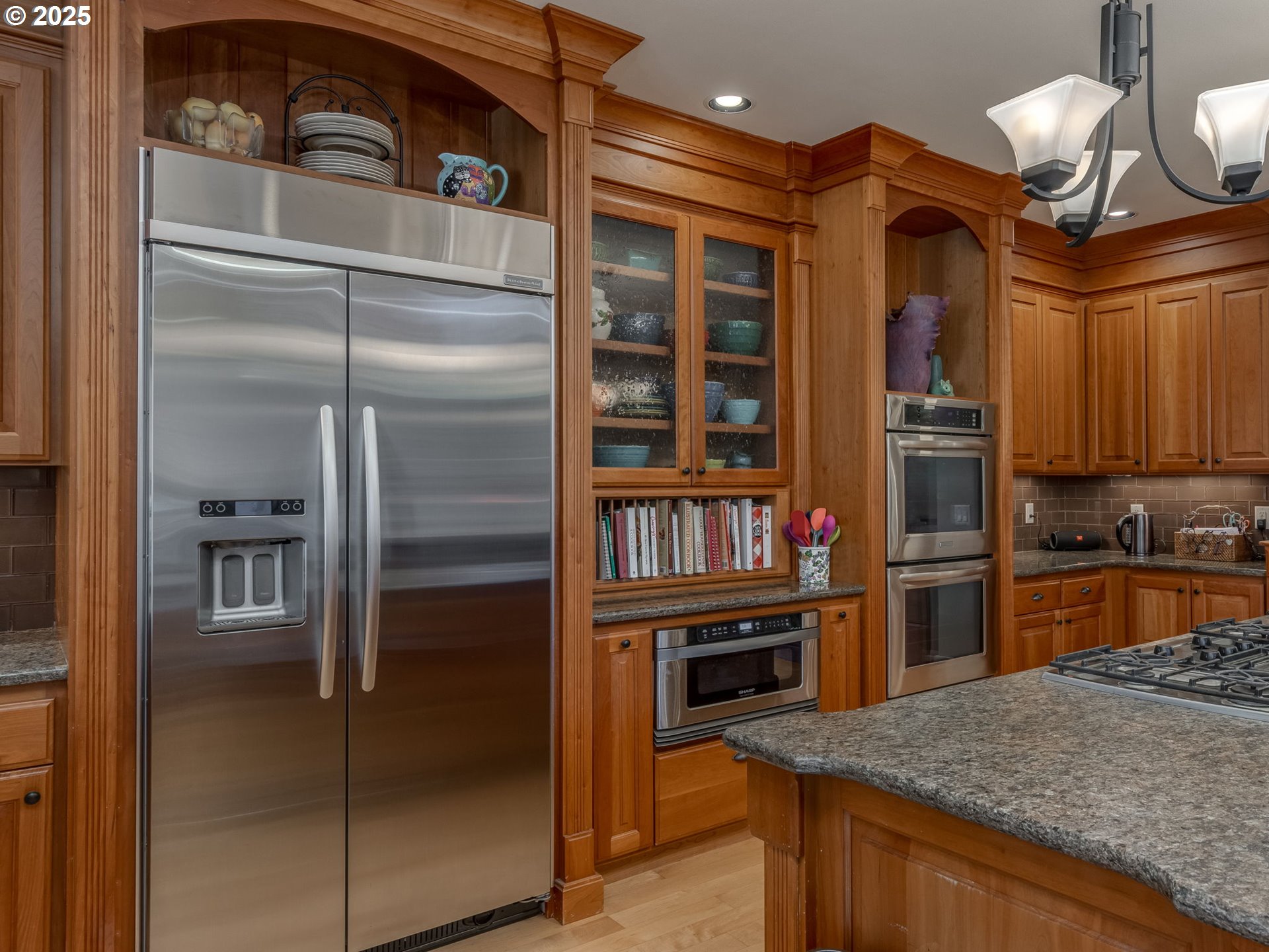 755 6th Street Lake Oswego, OR 97034 - Photo 12 of 48 a kitchen with stainless steel appliances granite countertop a refrigerator and a sink