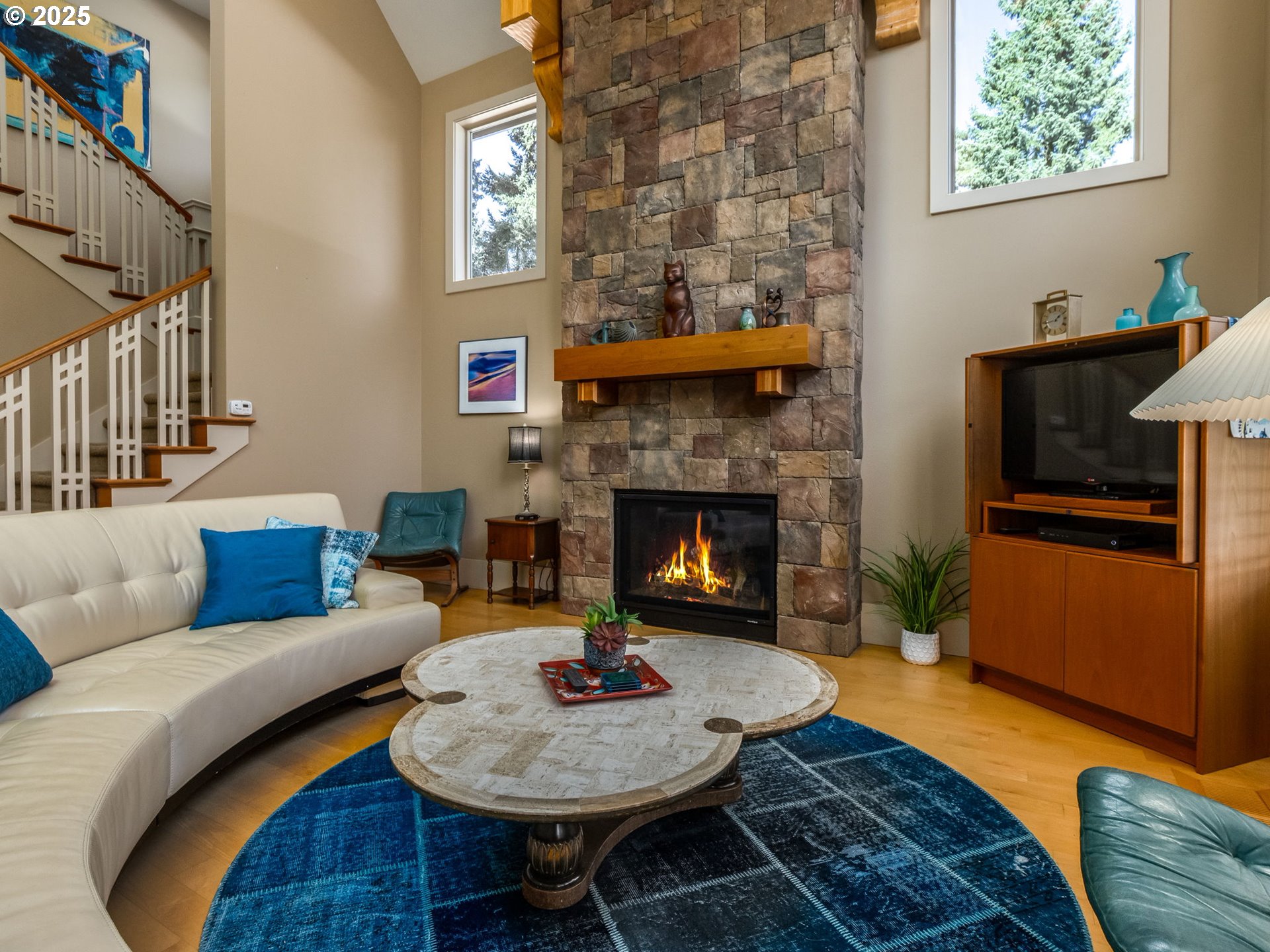 755 6th Street Lake Oswego, OR 97034 - Photo 16 of 48 a living room with furniture and a fireplace