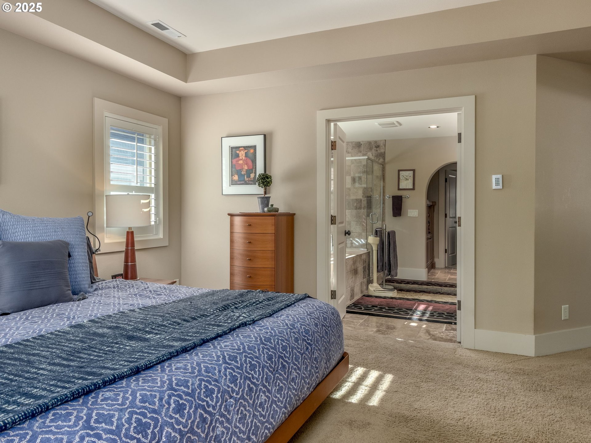 755 6th Street Lake Oswego, OR 97034 - Photo 20 of 48 a bedroom with a large bed and walk in closet