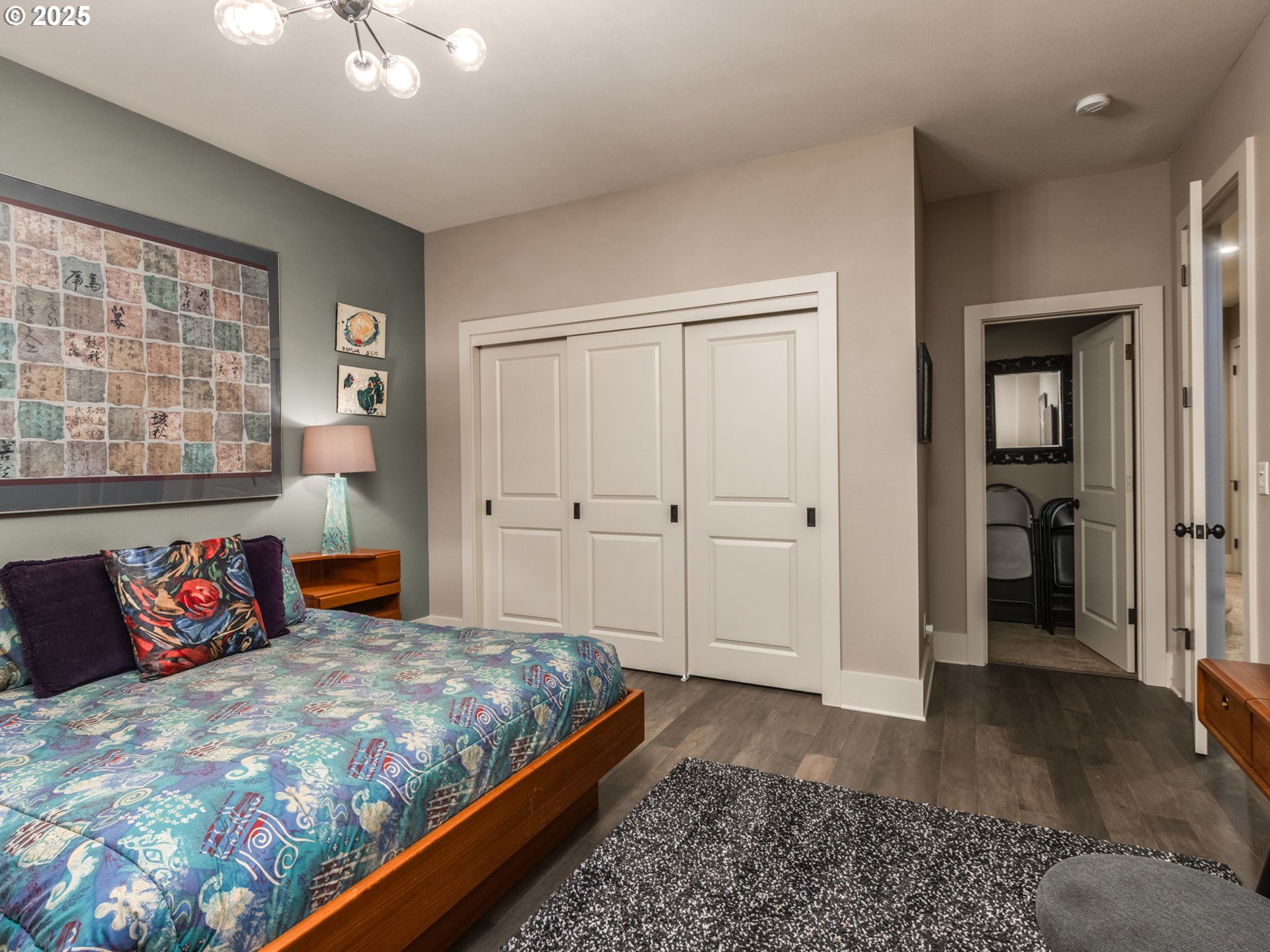 755 6th Street Lake Oswego, OR 97034 - Photo 33 of 48 a bedroom with a large bed and a chandelier