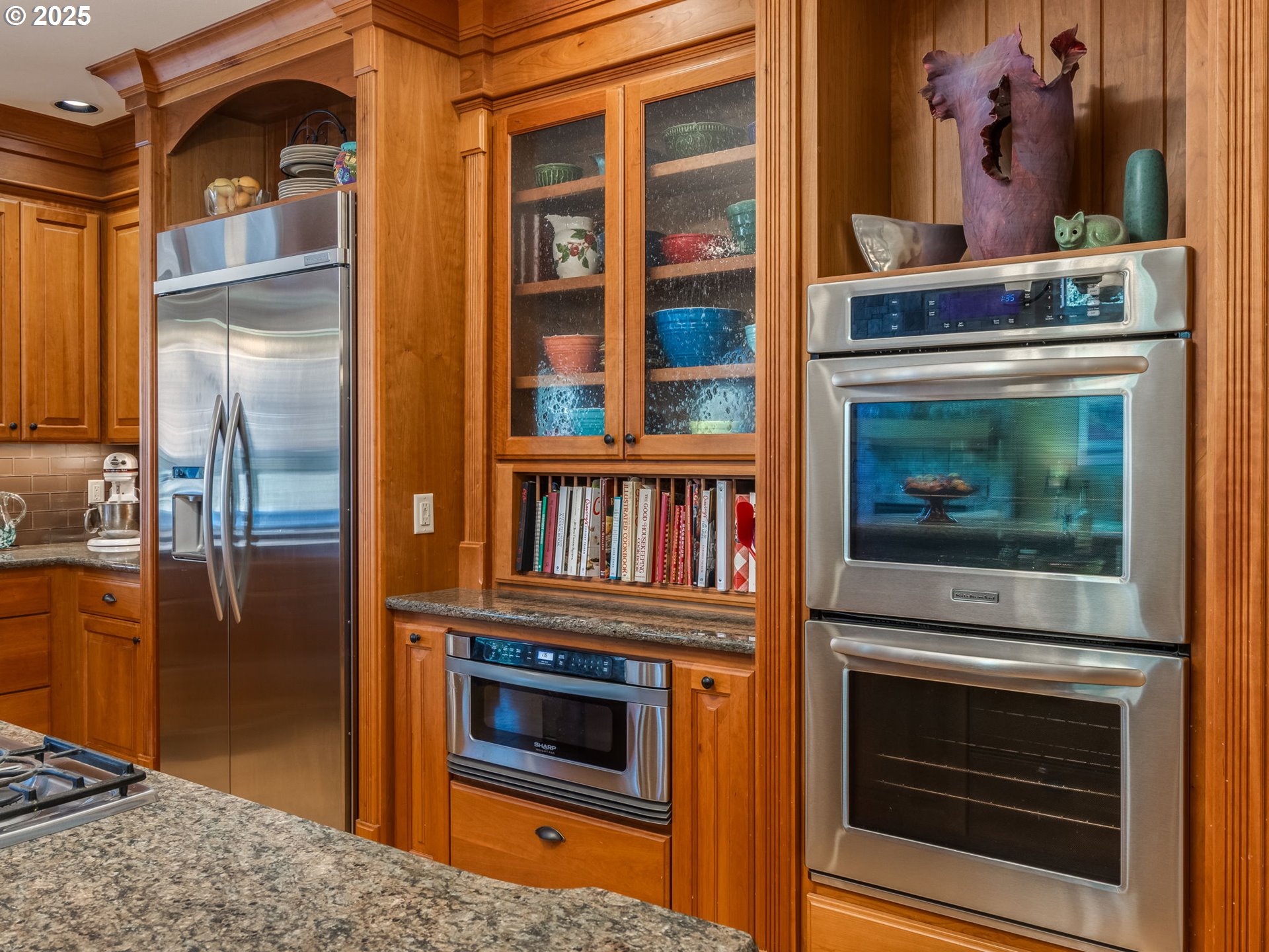 755 6th Street Lake Oswego, OR 97034 - Photo 9 of 48 a kitchen with stainless steel appliances granite countertop a stove and a refrigerator