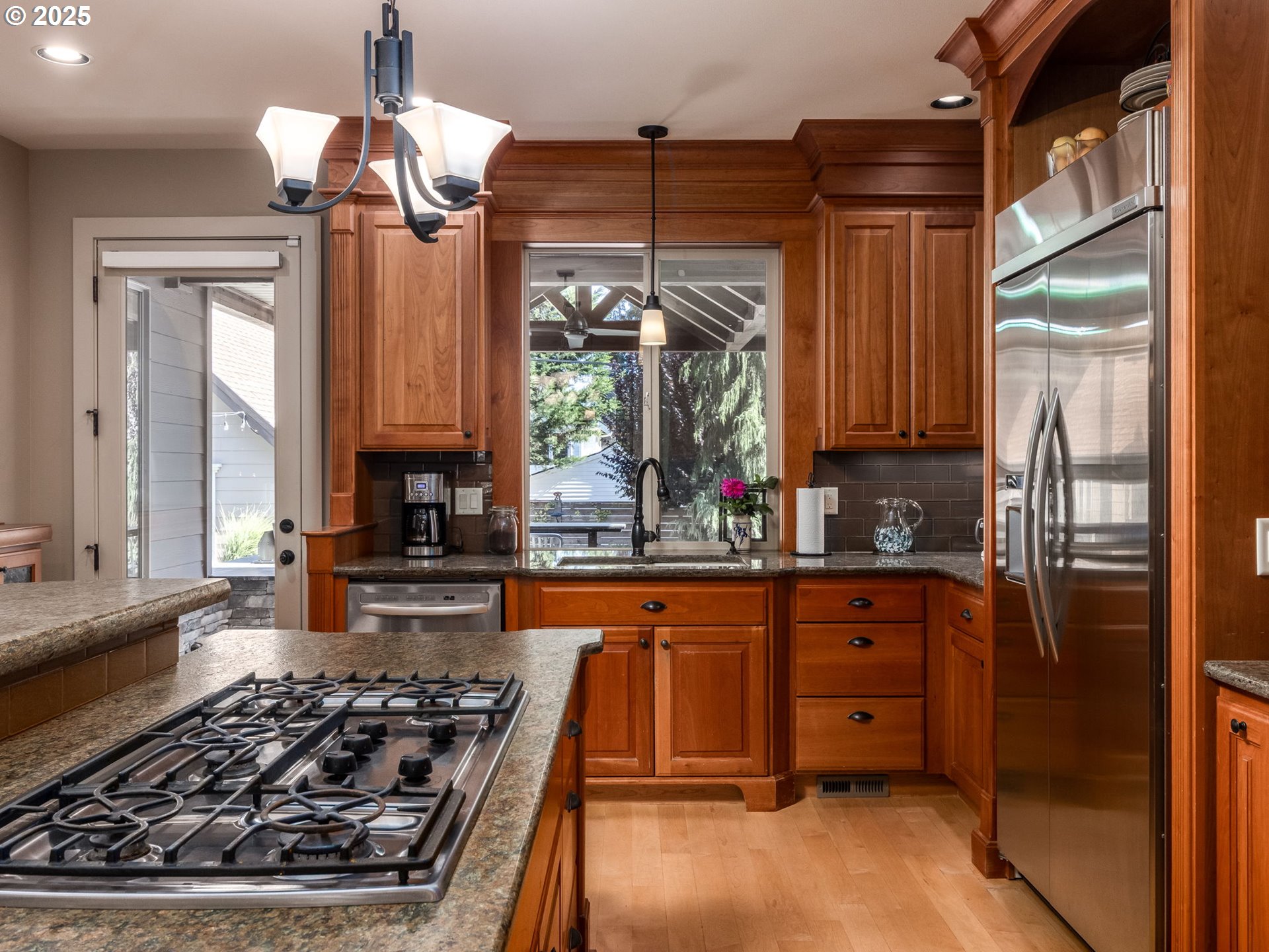 755 6th Street Lake Oswego, OR 97034 - Photo 10 of 48 a kitchen with wooden cabinets and a stove top oven