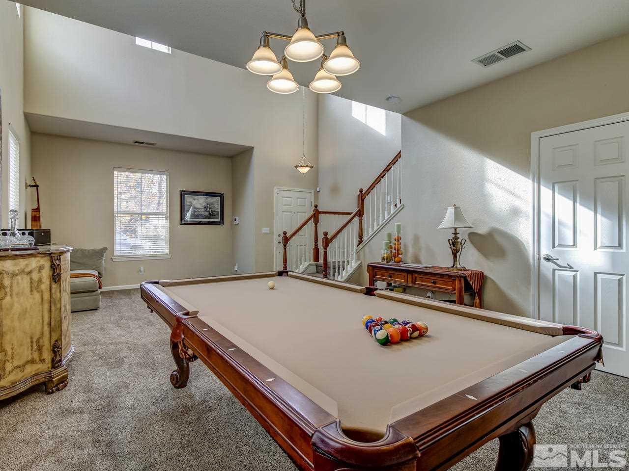 555 Little Sorrel Court Reno, NV 89521 - Photo 7 of 25 a room with table and chandelier