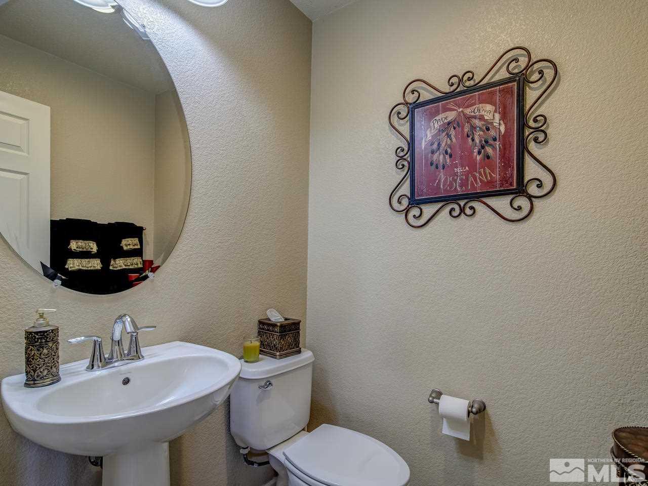 555 Little Sorrel Court Reno, NV 89521 - Photo 10 of 25 a bathroom with a toilet and a sink