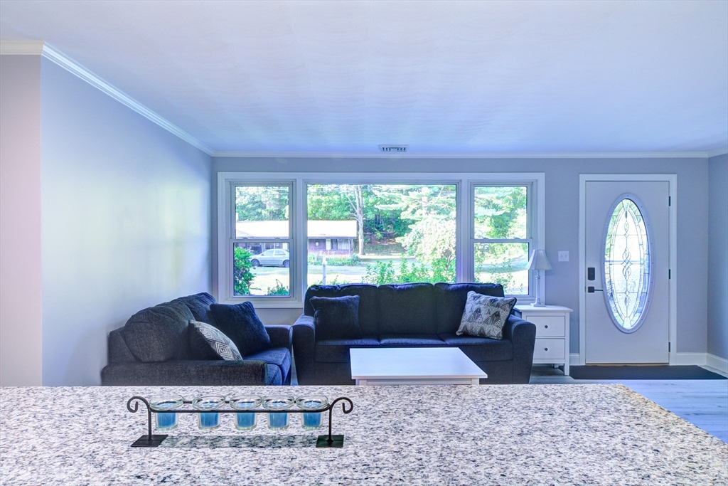 8 Craig Road Chelmsford, MA 01824 - Photo 15 of 32 a living room with furniture and a large window