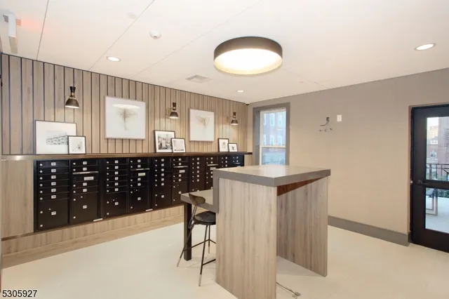 a kitchen with stainless steel appliances kitchen island granite countertop a sink and cabinets