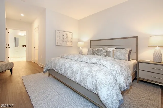 a bedroom with a bed and a couch