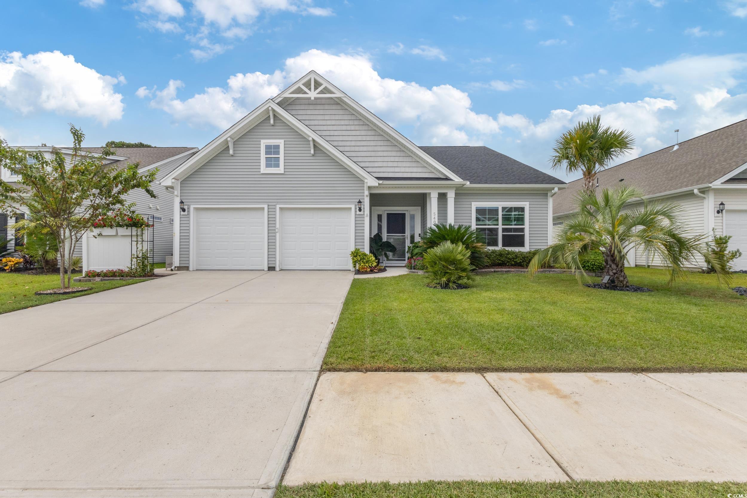 540 Canborough Lane Murrells Inlet, SC 29576 - Photo 2 of 40 View of front of house with driveway, a garage, and a front lawn