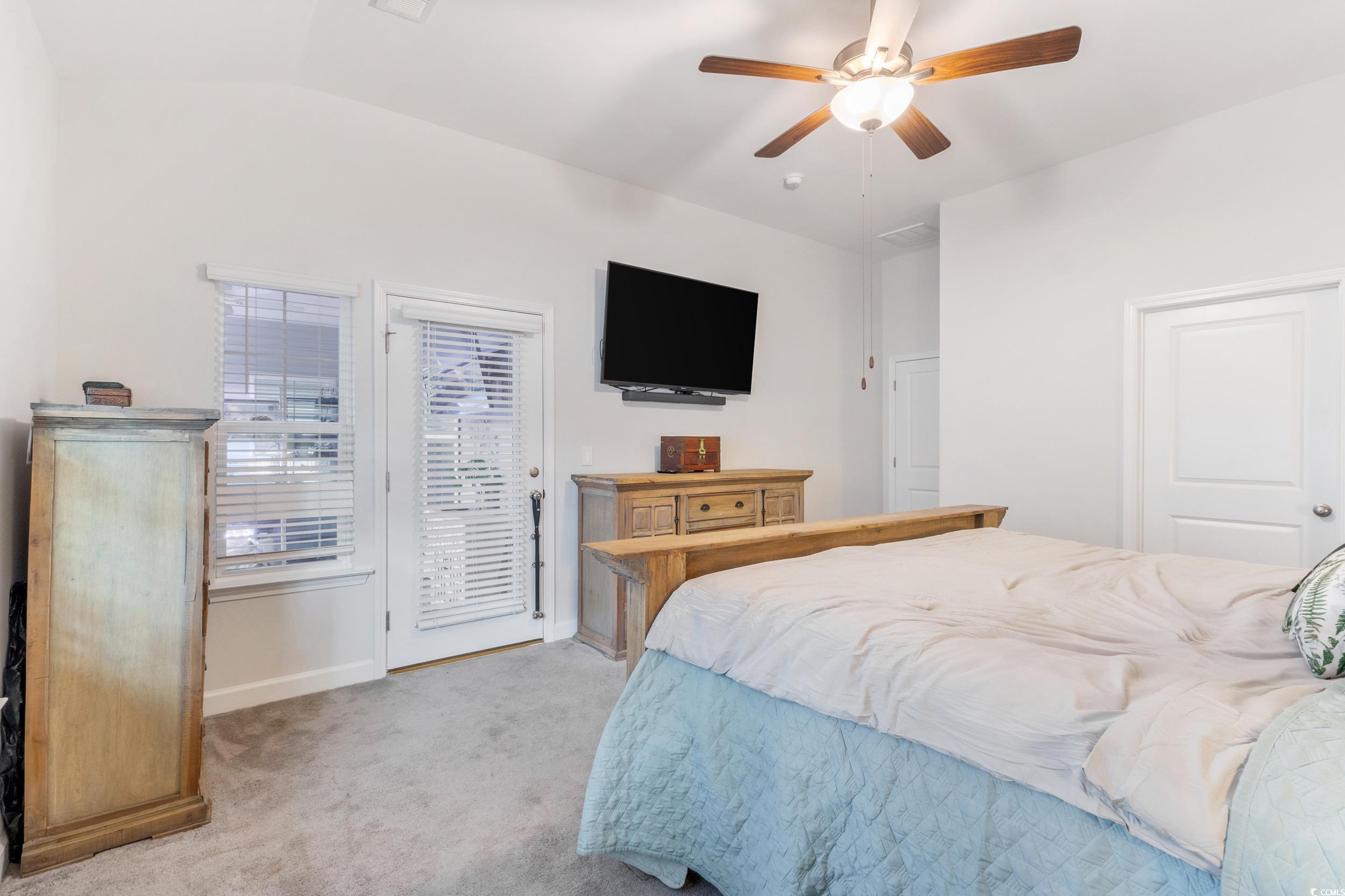 540 Canborough Lane Murrells Inlet, SC 29576 - Photo 21 of 40 Bedroom featuring access to outside, light carpet, ceiling fan, and vaulted ceiling
