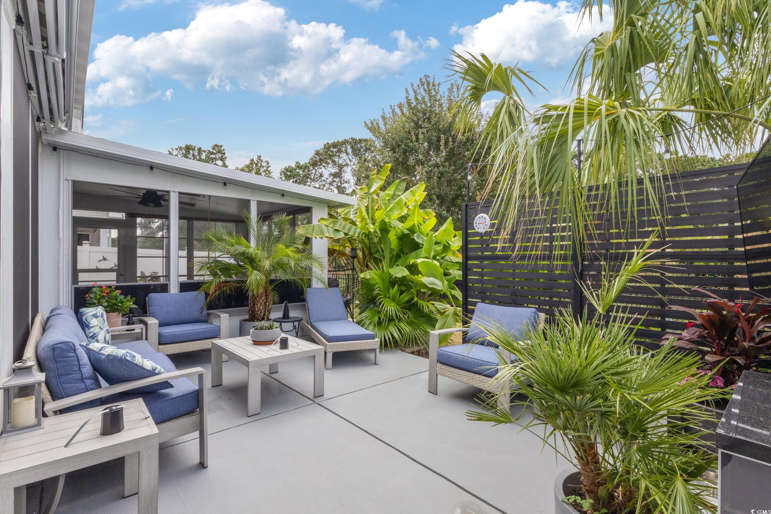 540 Canborough Lane Murrells Inlet, SC 29576 - Photo 35 of 40 View of patio featuring outdoor lounge area and a sunroom