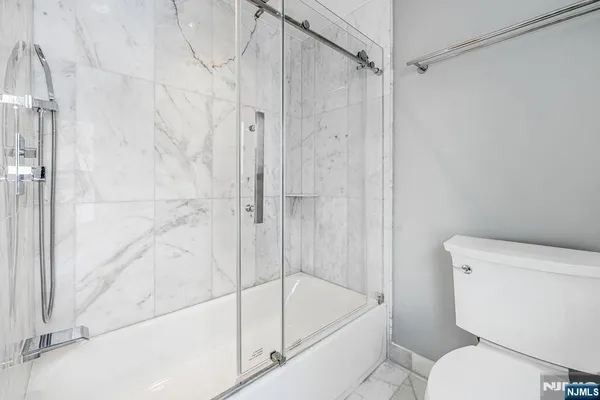 a bathroom with a toilet and a bathtub