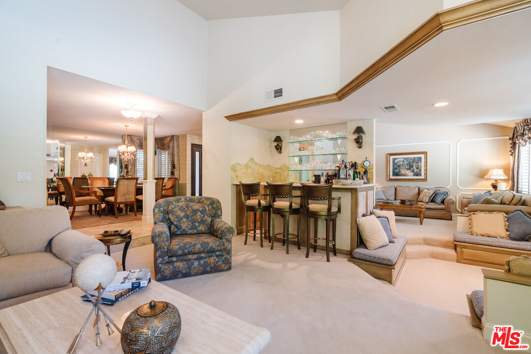 17835 Lemarsh Street Northridge, CA 91325 - Photo 11 of 41 a living room with furniture and a large mirror