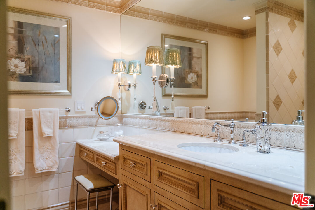 17835 Lemarsh Street Northridge, CA 91325 - Photo 29 of 41 a bathroom with a sink and a mirror
