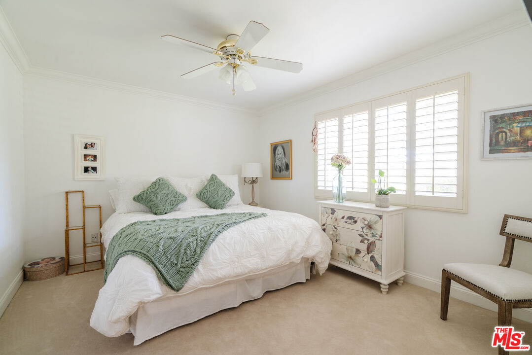 17835 Lemarsh Street Northridge, CA 91325 - Photo 33 of 41 a bedroom with a bed and a chandelier