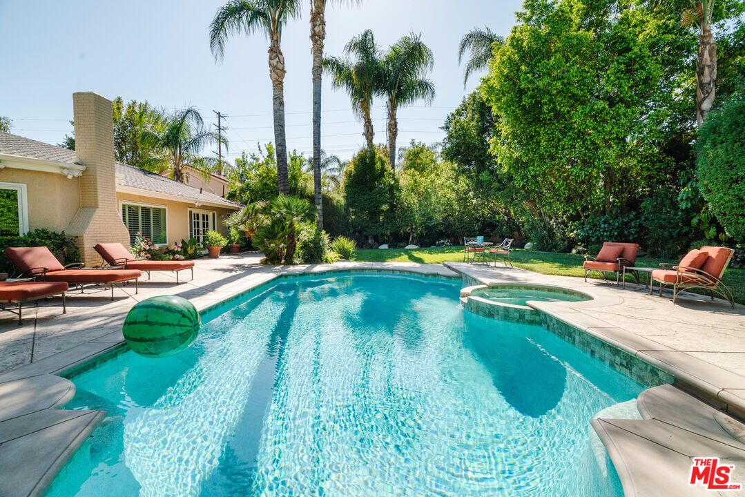 17835 Lemarsh Street Northridge, CA 91325 - Photo 37 of 41 a swimming pool with outdoor seating and yard
