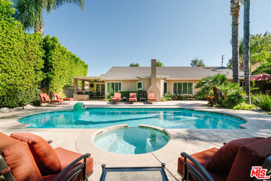 17835 Lemarsh Street Northridge, CA 91325 - Photo 4 of 41 a view of a swimming pool and lounge chair