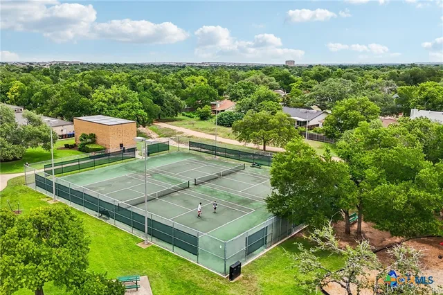 a view of a park with swings