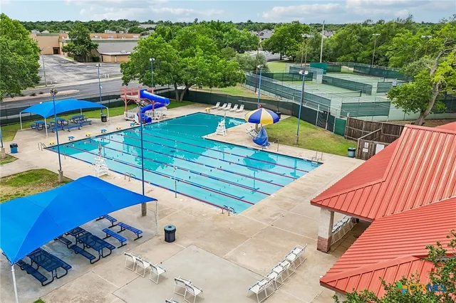 a view of a living room and kitchen