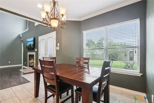a view of a dining room with furniture window and outside view